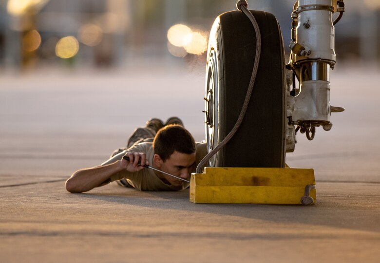 Crew chief, inspects a F-35A Lightning II wheel