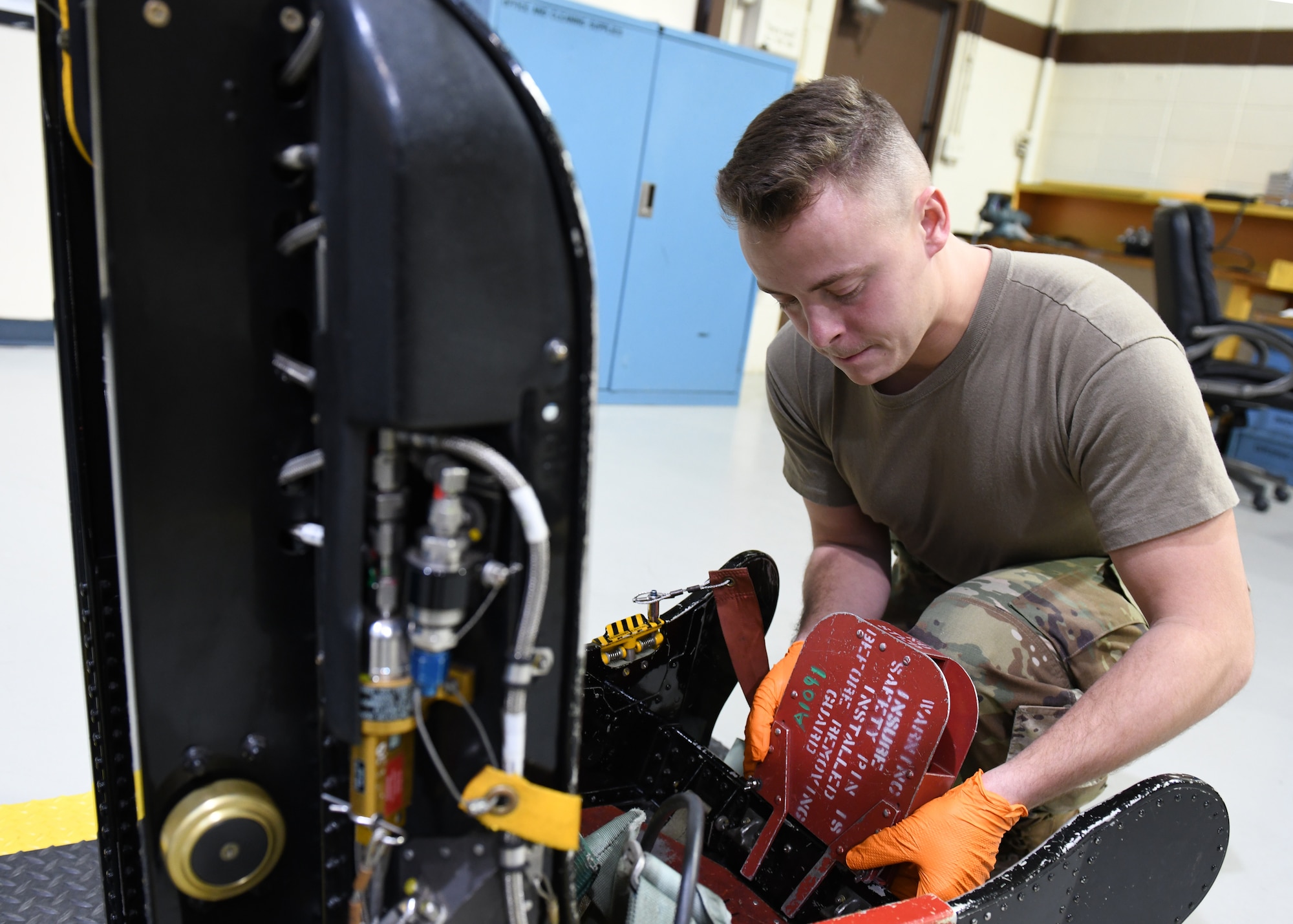 Airman 1st Class Robert Dumback, 9th Maintenance Squadron aircrew egress systems journeyman, installs a D-ring guard on a U-2 Dragon Lady egress seat Jan. 14, 2020 at Beale Air force Base, California. A D-ring is the component of an egress seat that a pilot pulls to eject. The purpose of a D-ring guard is to protect the D-ring and prevent the accidental activation of an egress seat. (U.S. Air Force photo by Airman 1st Class Luis A. Ruiz-Vazquez)