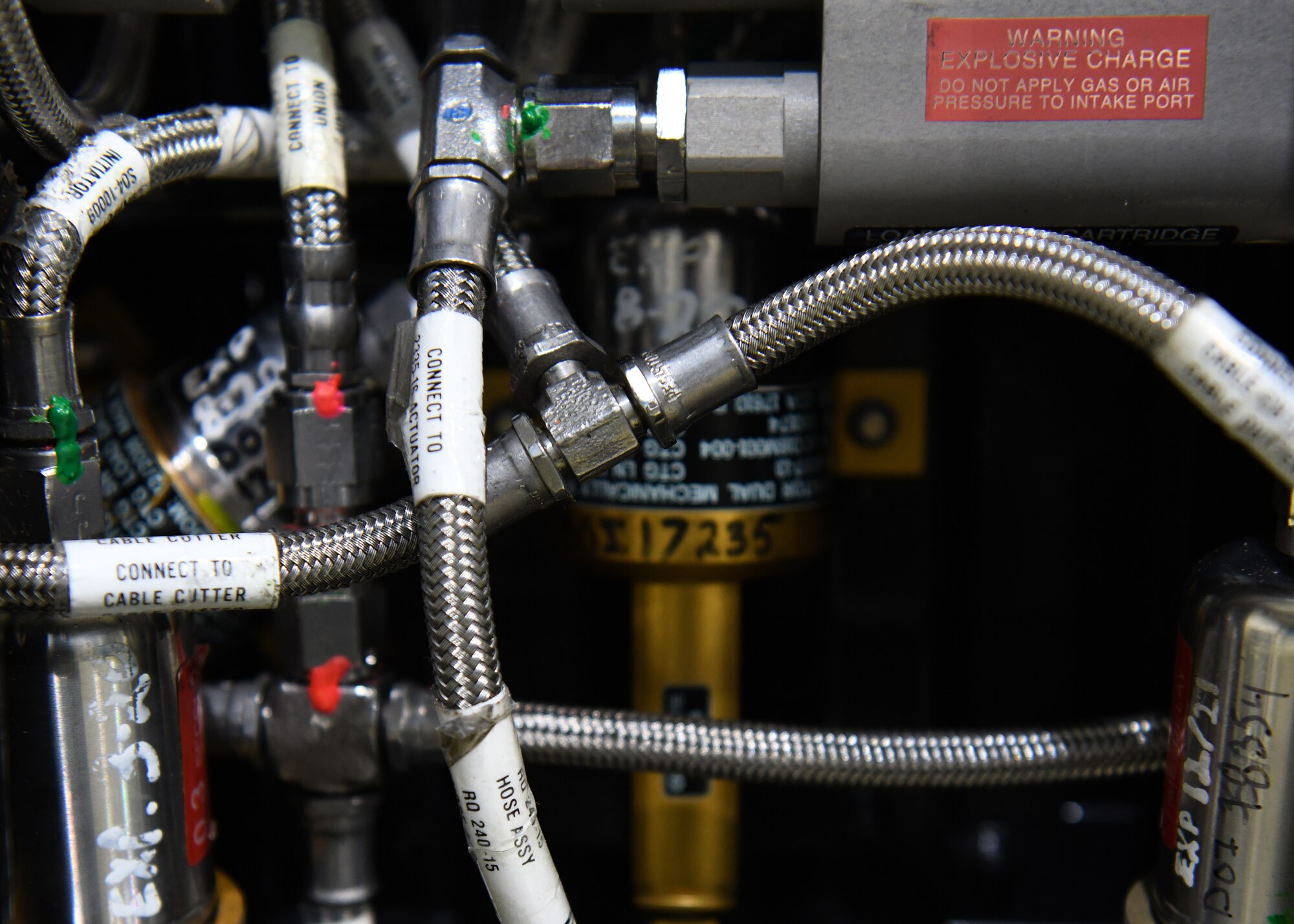 Intricate components located the bottom of an egress seat, waiting to be installed to a U-2 Dragon Lady, Jan. 14, 2020 at Beale Air Force Base, California. If a pilot ever needs to eject from an aircraft, gas pressure will be sent through these hoses and to the explosives so that a pilot can escape the aircraft. (U.S. Air Force photo by Airman 1st Class Luis A. Ruiz-Vazquez)