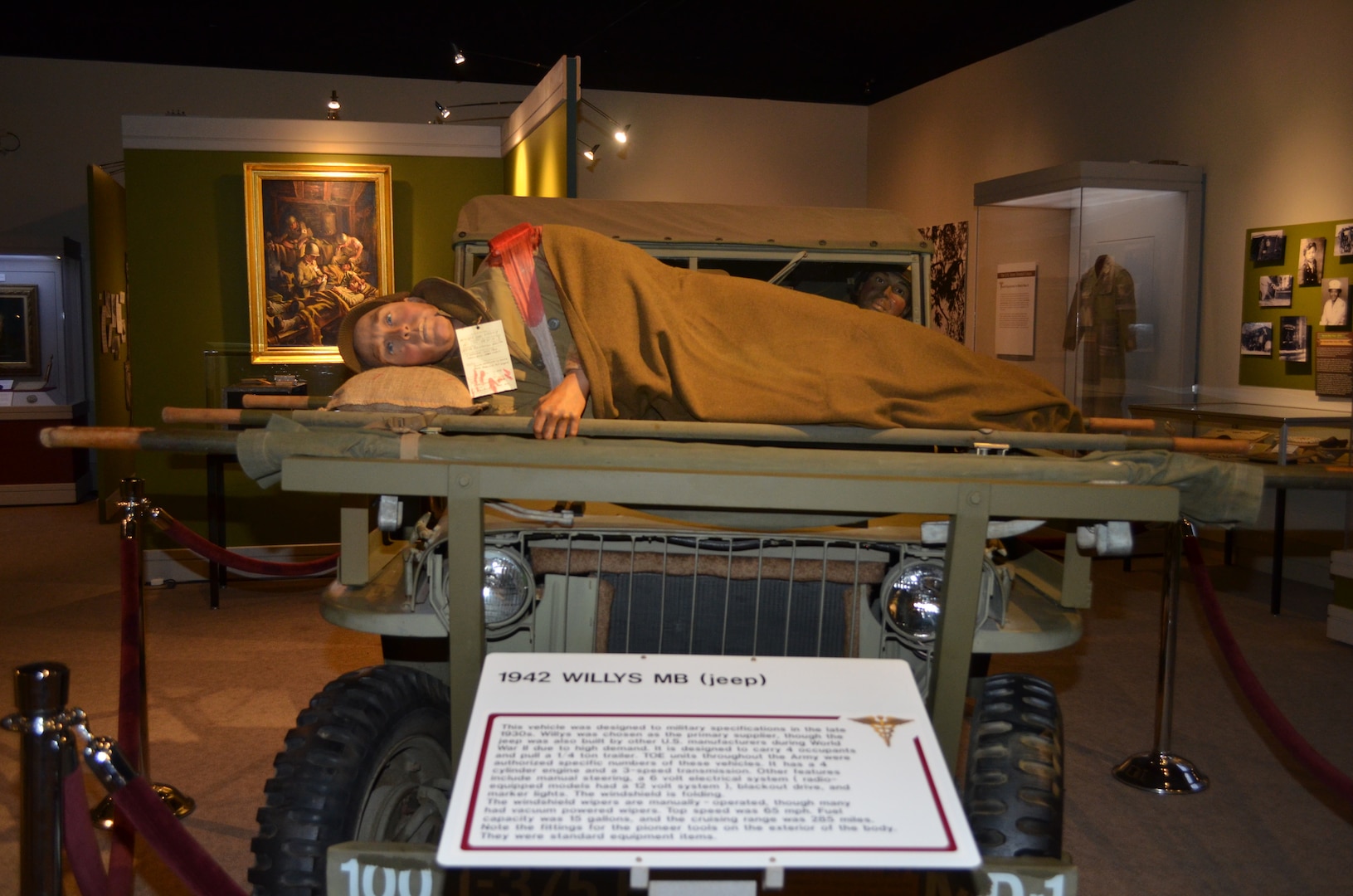An exhibit depicting a wounded service member being evacuated on an improvised stretcher carrier bolted to a frame of a jeep during the Battle of the Bulge in 1945 is one of two new diorama displays at the U.S. Army Medical Department Museum at Joint Base San Antonio-Fort Sam Houston.