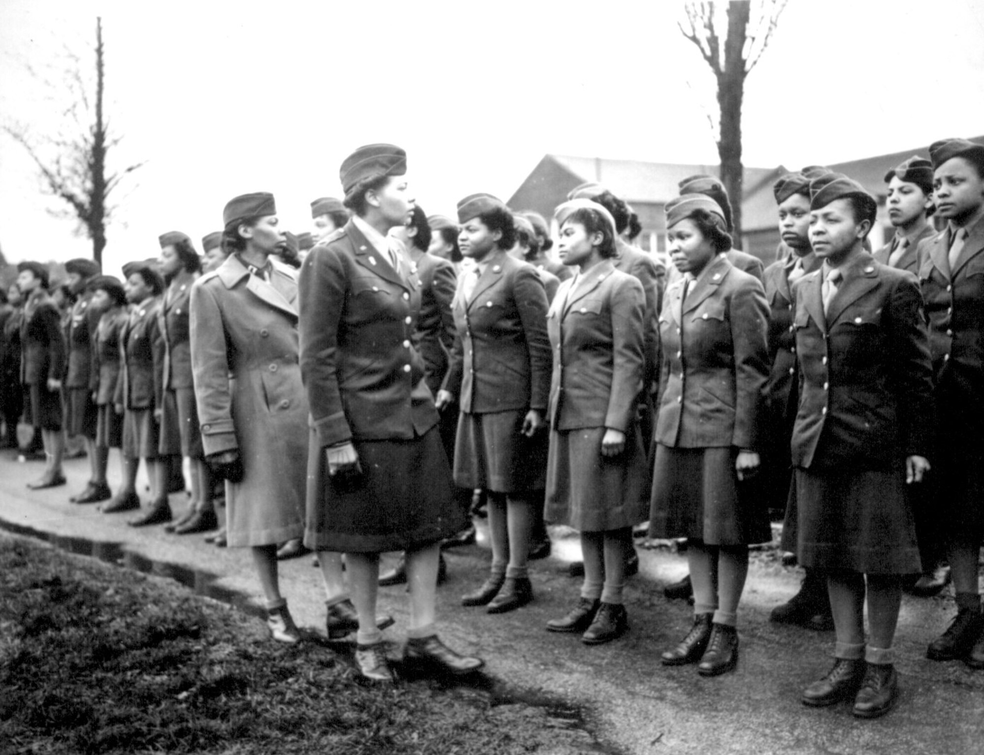 Maj. Charity E. Adams and Capt. Abbie N. Campbell inspect the first contingent of black members of the Women’s Army Corps assigned to overseas service, Feb. 15, 1945, England.