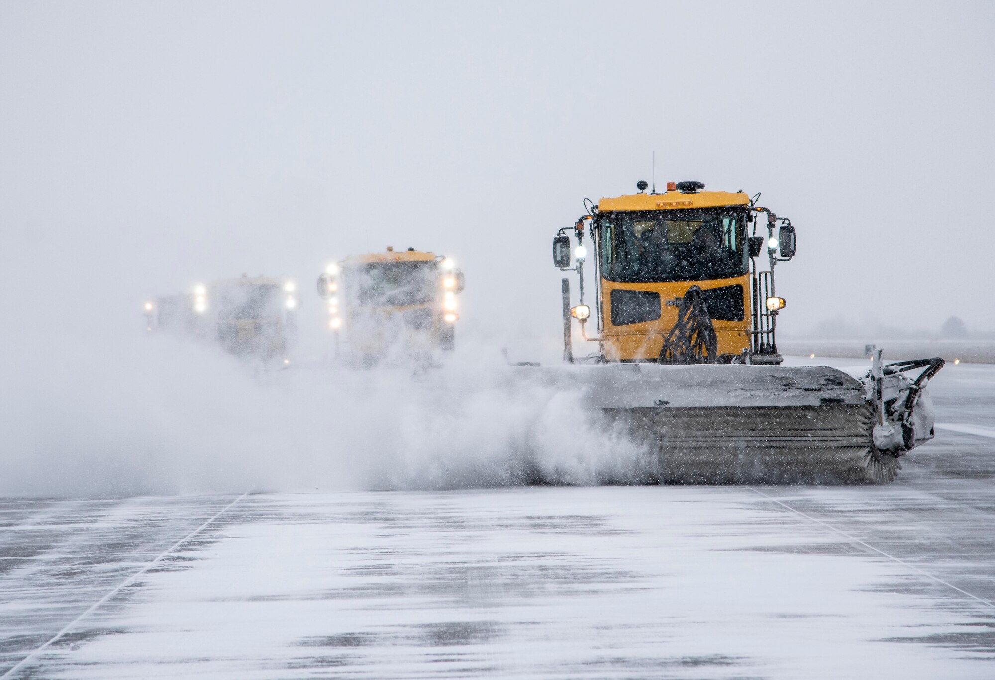 92nd Civil Engineering Squadron members drive broom sweepers at Fairchild Air Force Base, Washington, Jan. 10, 2020.