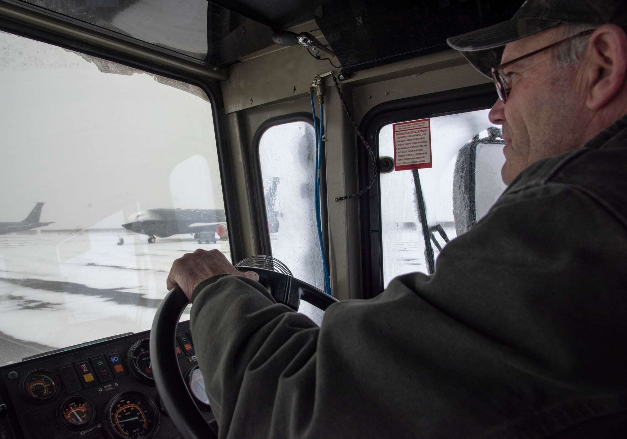 Jeff Seagle, 92nd Civil Engineering Squadron heavy equipment operator, drives a broom sweeper vehicle at Fairchild Air Force Base, Washington, Jan. 10, 2020.