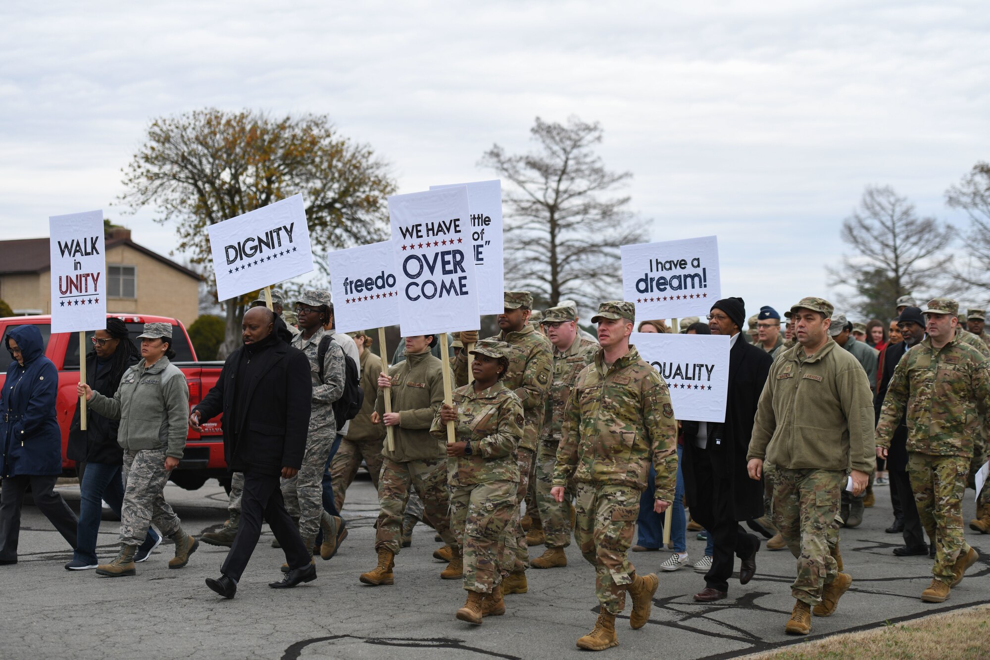 Members of Team Little Rock participate in a remembrance walk and sing “We Shall Overcome” in honor of Dr. Martin Luther King Jr. at Little Rock Air Force Base, Arkansas, Jan. 17, 2020.
