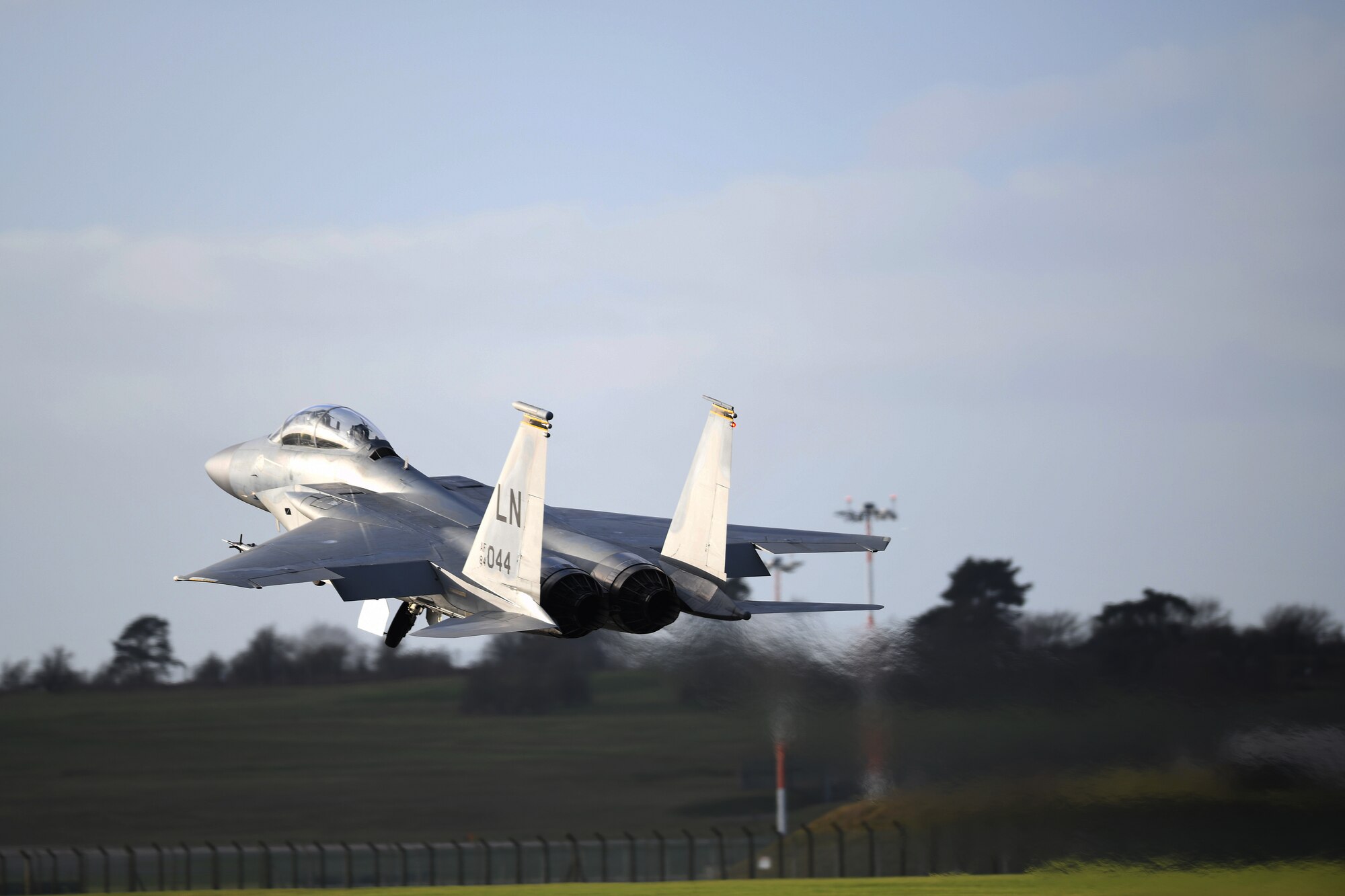 An F-15C Eagle carrying Civil Air Patrol Cadet Zane Fockler, Mildenhall Cadet Squadron cadet, takes off for a familiarization flight at Royal Air Force Lakenheath, England, January 10, 2019. Flockler was awarded the highest prestigious award in the Civil Air Patrol, the Gen. Carl A. Spaatz Award for demonstrating excellence in leadership, character, fitness, and aerospace education. (U.S.Air Force photo by Senior Airman Shanice Williams-Jones)
