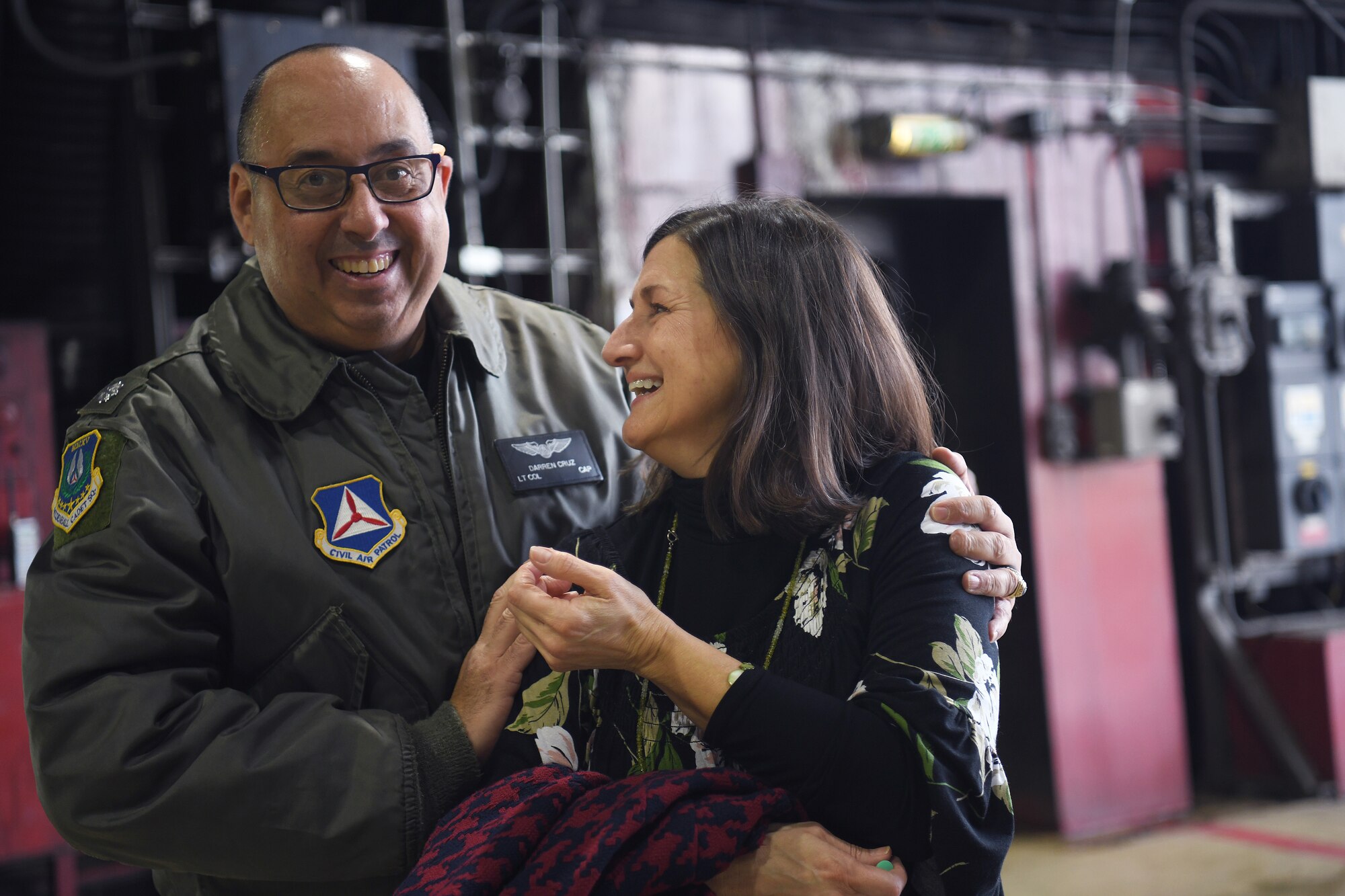 Civil Air Patrol Lt. Col. Darren Cruz, Mildenhall Cadet Squadron Commander, reassures Kelli Fockler before her son’s familiarization flight at Royal Air Force Lakenheath, England, January 10, 2019. Fockler was awarded the familiarization flight to recognize his successes and prepare him for his dream to be a pilot in the U.S. Air Force. (U.S.Air Force photo by Senior Airman Shanice Williams-Jones)