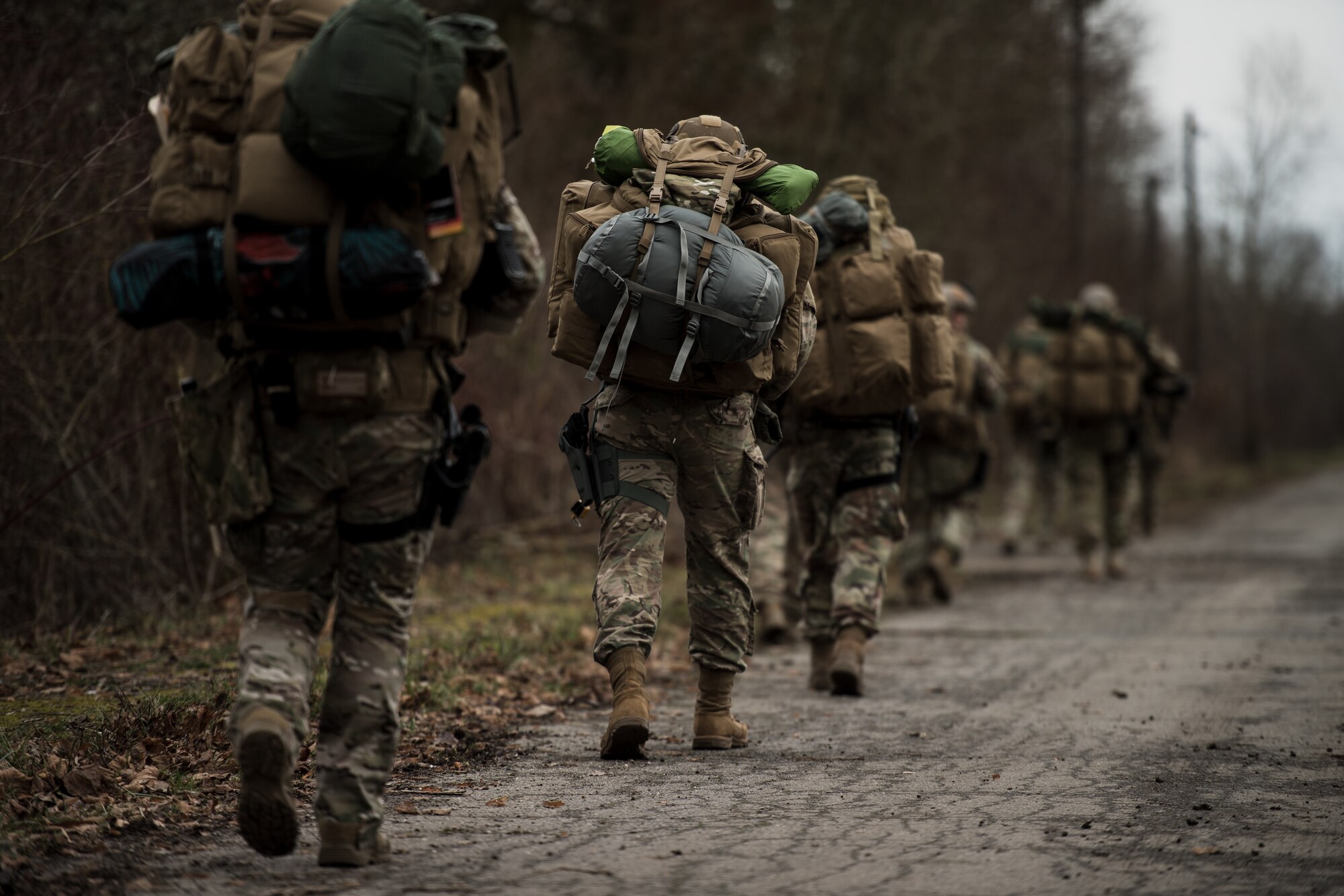 U.S. Airmen assigned to the 435th Security Forces Squadron carry their supplies to a rally point during exercise Frozen Defender in Grostenquin, France, Jan. 14, 2020. Frozen Defender tests the squadron’s capabilities in a contested environment under harsh conditions. The Defenders quietly entered the training site in formation while providing security from all directions. (U.S. Air Force photo by Staff Sgt. Devin Boyer)