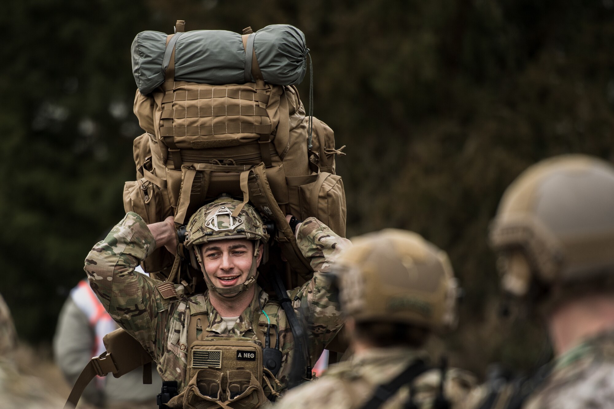 U.S. Air Force Staff Sgt. Mark Melchiori, 435th Security Forces Squadron contingency response fire-team leader, hoists a rucksack over his head after stepping off a bus for exercise Frozen Defender in Grostenquin, France, Jan. 14, 2020. Frozen Defender tests the squadron’s capabilities in a contested environment under harsh conditions. The 435th SFS Defenders must be physically prepared to carry more than 70 lbs of equipment into these environments. (U.S. Air Force photo by Staff Sgt. Devin Boyer)