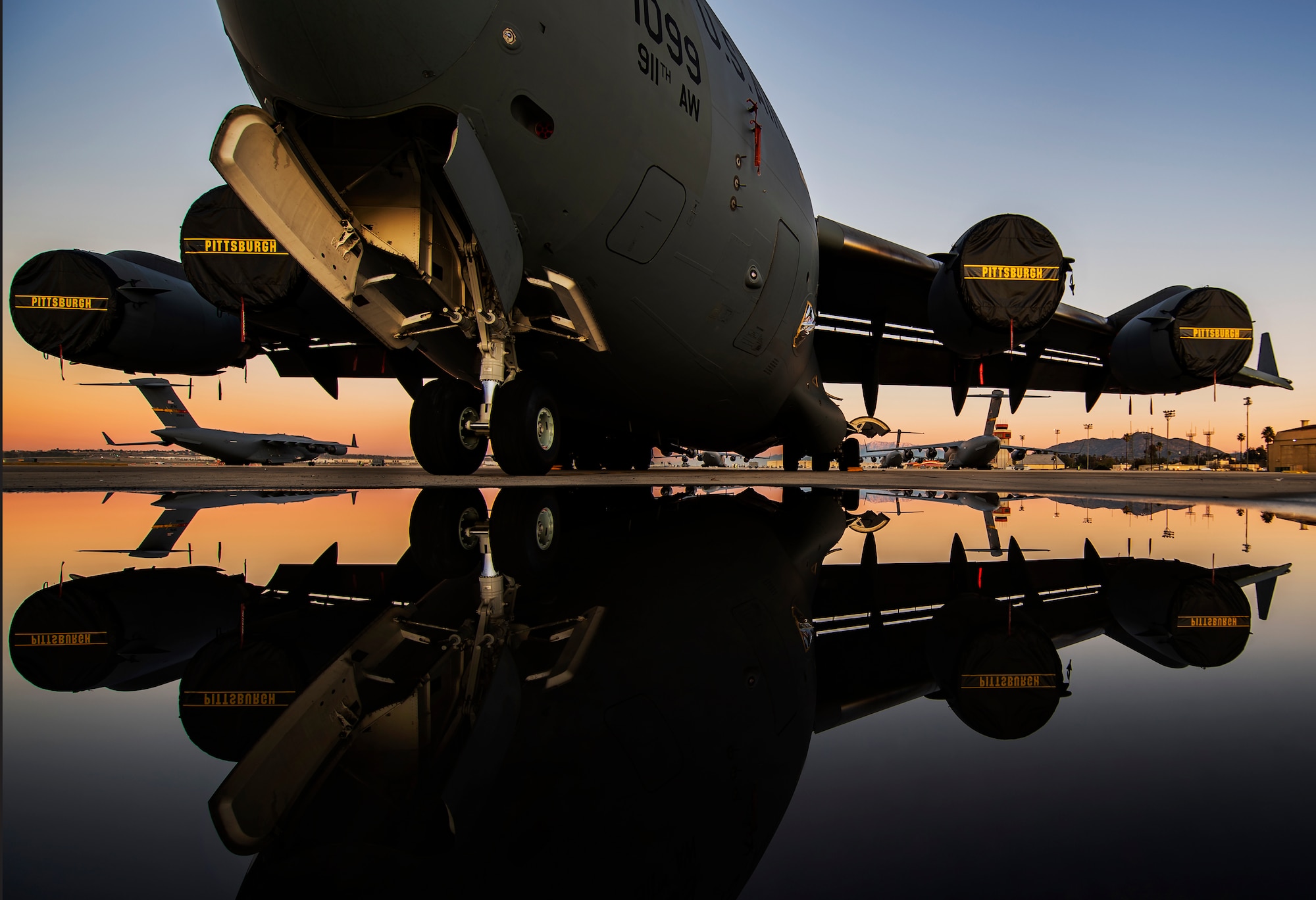 A C-17 Globemaster III sits on the flightline