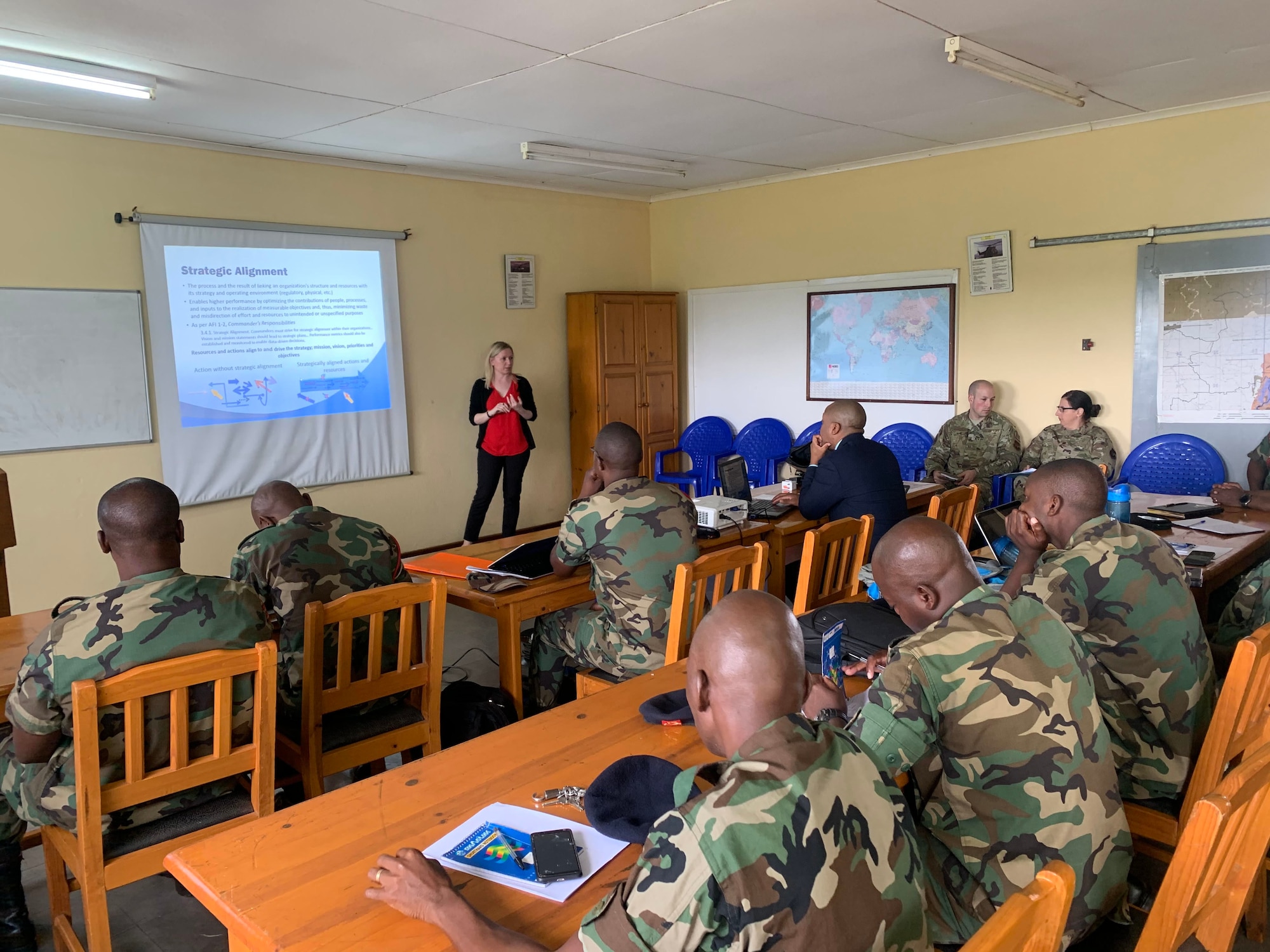 Lydia Bradley, U.S. Air Forces in Europe and Air Forces Africa Manpower, Personnel and Services Directorate, Force Development team, briefs continuous process improvement to members of the Malawian air force at Lilongwe Air Base, Malawi, Jan. 14, 2020. Bradley is part of a force development team that has been working with the Malawian air force since 2018 to build partnership capacity in the region. (U.S. Air Force photo by Capt. Korey Fratini)