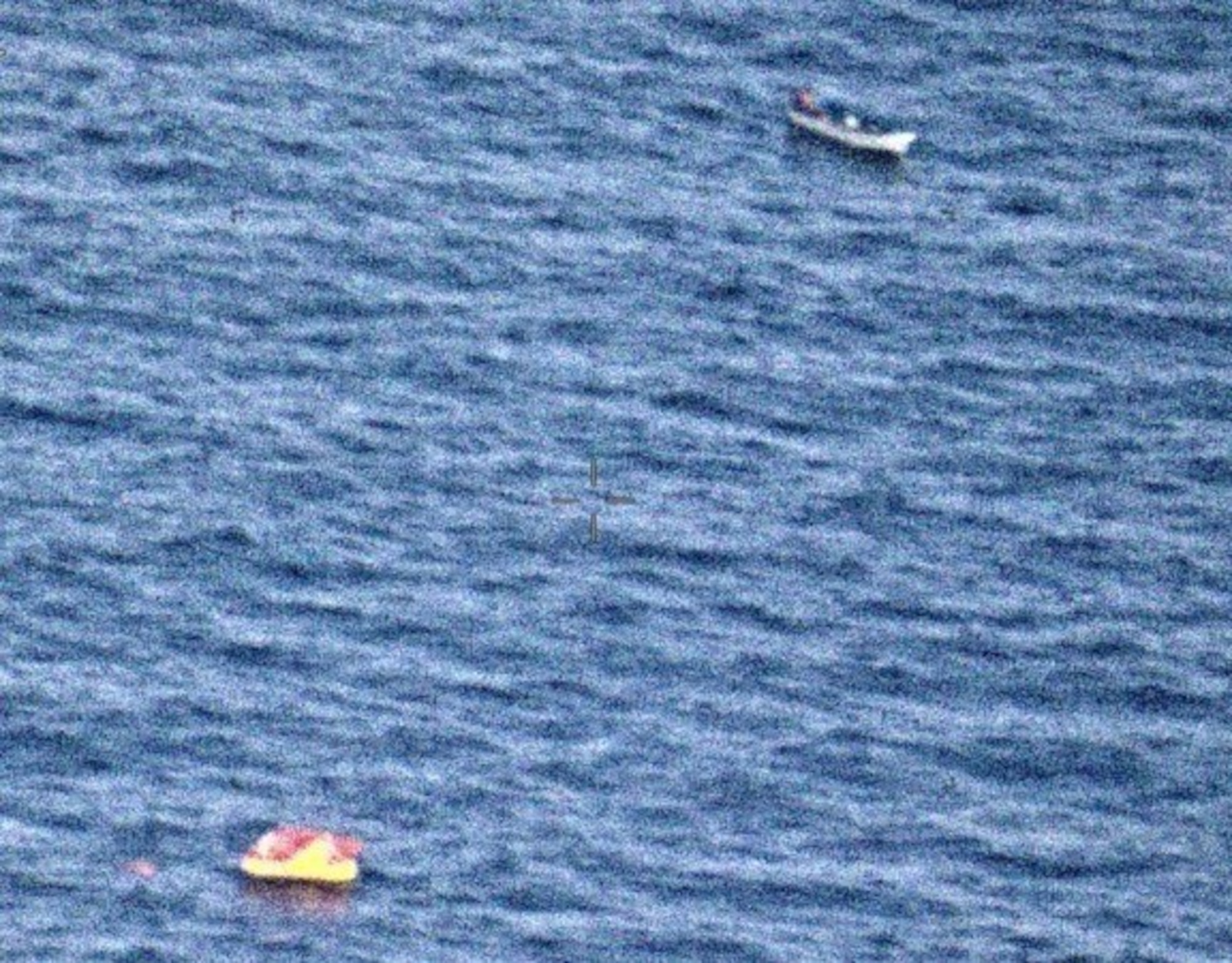 Patrol Squadron 45 Sailors conduct a Search and Rescue (SAR) of the coast of Guam, dropping a search and rescue kit to a stranded fisherman.
