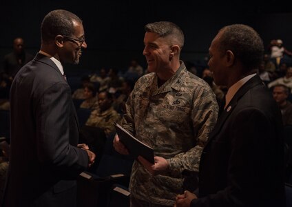 Darrell Harris (left), 7th Transportation Group integrated logistics support manager, Sayres and Associated Corp., and Donnie Tuck (right), Hampton City mayor, speak with U.S. Air Force Col. Clinton Ross, 633rd Air Base Wing commander, before a ceremony honoring the life and legacy of Dr. Martin Luther King Jr. at Joint Base Langley-Eustis, Virginia, Jan. 17, 2019. In the time before his death, Dr. Martin Luther King Jr. and others from the Civil Rights Movement helped to alter the system of inequality in our country and help make a better world for the underprivileged.