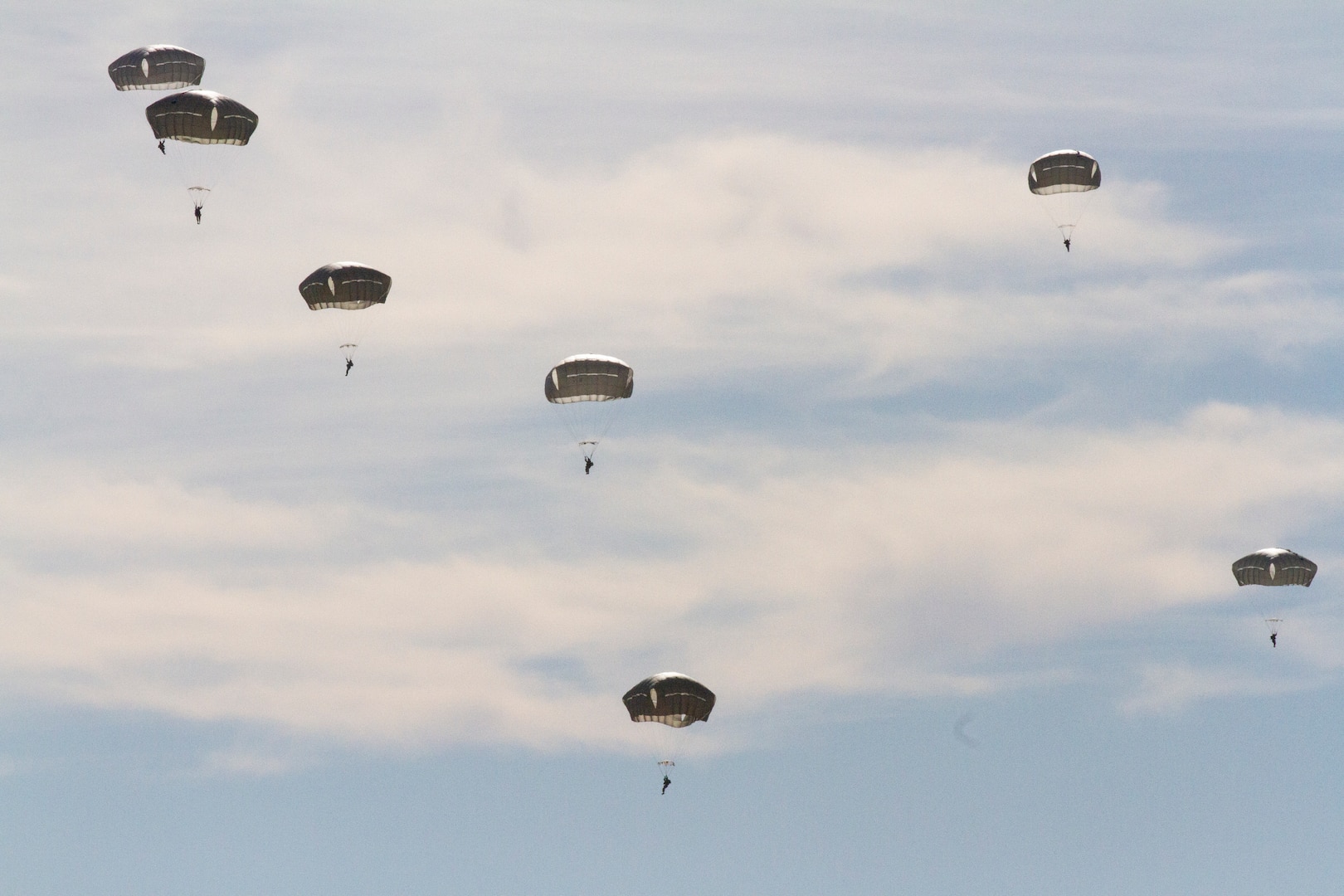 Airborne Soldiers deploy parachutes during airborne drop training.