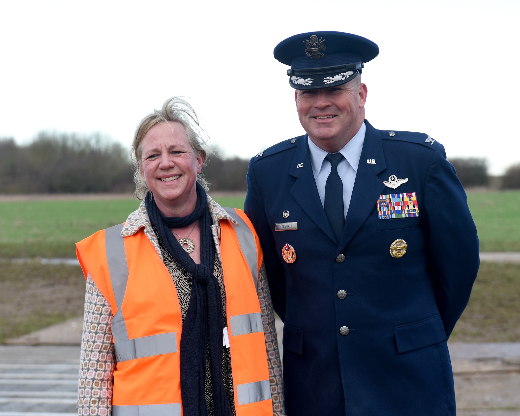 Col. Will Marshall, 48th Fighter Wing commander, poses for a photo with Alice Pawsey, land owner of Lavenham Airfiled,at Lavenham Airfield, England, Jan. 20, 2020. Marshall visited Lavenham Airfield to help lay down the first brick for a long-lasting memorial honoring 233 U.S. military service members that died in World War II. (U.S. Air Force photo by Airman 1st Class Madeline Herzog)