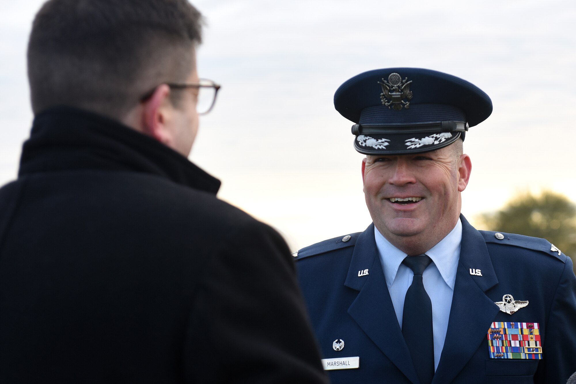 Col. Will Marshall, 48th Fighter Wing commander, talks to a community member at Lavenham Airfield, England, Jan. 20, 2020. Marshall visited Lavenham Airfield to help lay down the first brick for a long-lasting memorial honoring 233 U.S. military service members that died in World War II. (U.S. Air Force photo by Airman 1st Class Madeline Herzog)