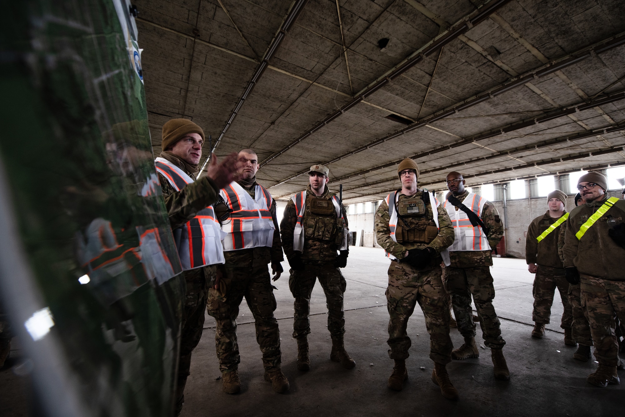 U.S. Air Force Maj. Doug Dinkins, 435th Security Forces commander, briefs evaluators and observers about exercise Frozen Defender in Grostenquin, France, Jan. 14, 2020. Frozen Defender tests the squadron’s capabilities in a contested environment under harsh conditions. The evaluators and observers provided feedback to strengthen the Defenders’ proficiencies. (U.S. Air Force photo by Staff Sgt. Devin Boyer)