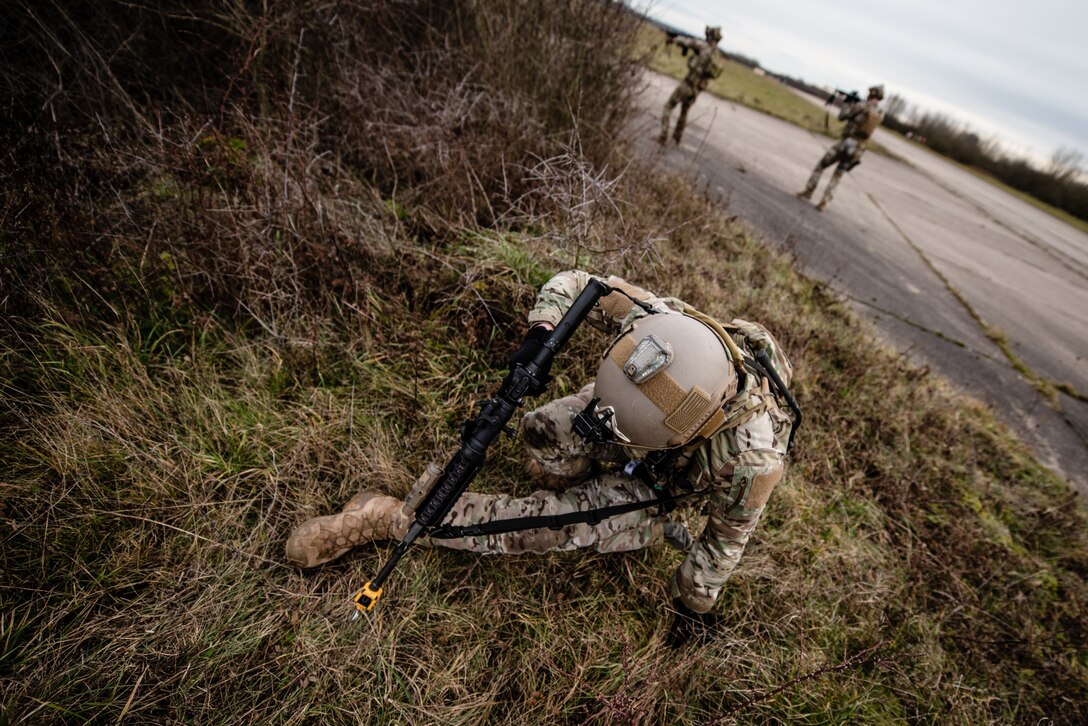 U.S. Staff Sgt. Aaron Kostiuk, 435th Security Forces Squadron ground combat readiness training center instructor, stands up after applying a tourniquet to himself during exercise Frozen Defender in Grostenquin, France, Jan. 14, 2020. Frozen Defender tests the squadron’s capabilities in a contested environment under harsh conditions. The use of self-aid and buddy care allowed the Defenders to continue the mission and thwart any hostile forces from taking control of the airfield. (U.S. Air Force photo by Staff Sgt. Devin Boyer)