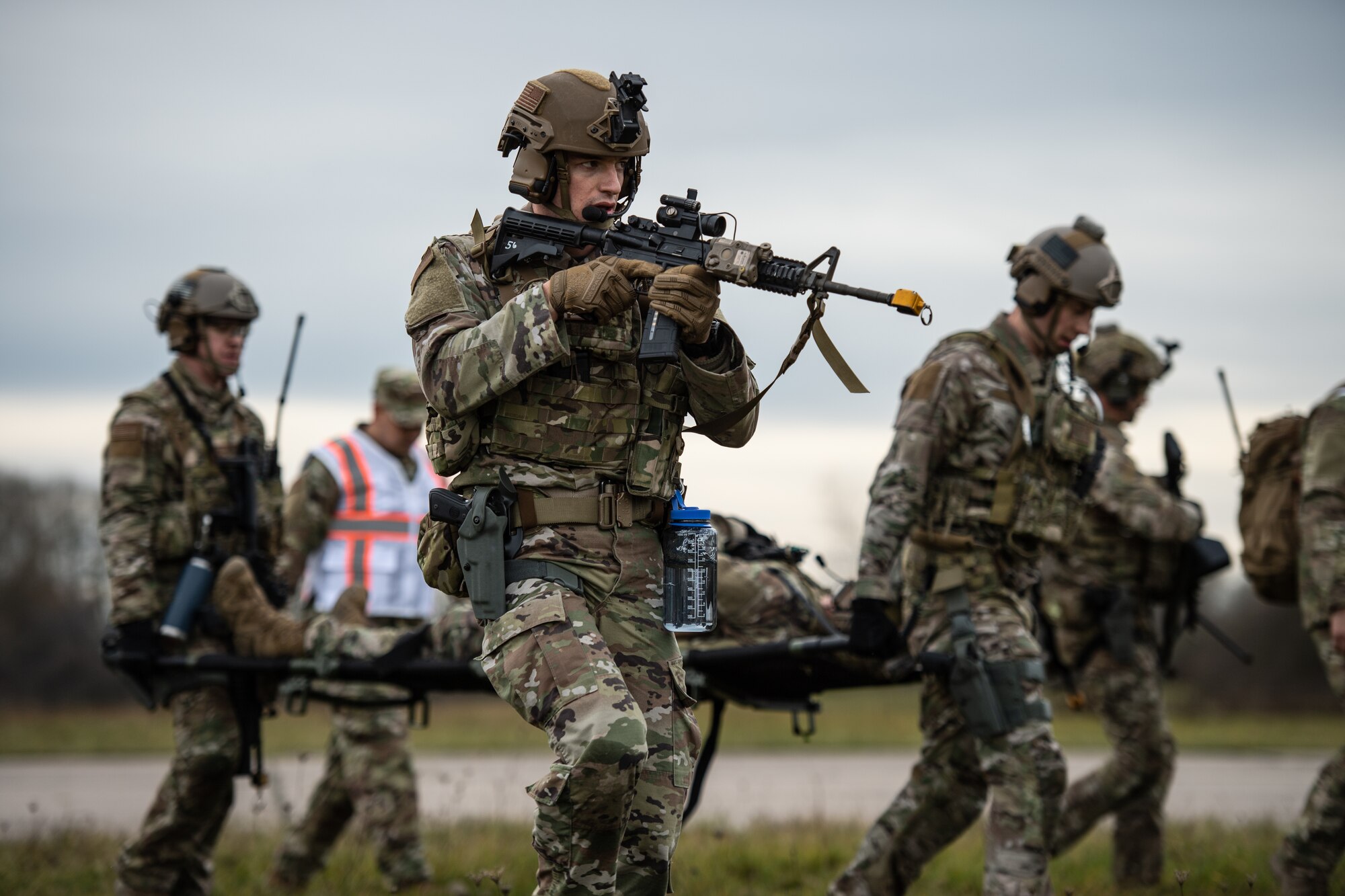 U.S. Air Force Senior Airman Ryan Silva, 435th Security Forces Squadron contingency response team member, provides security for his comrades while they carry a simulated casualty during exercise Frozen Defender in Grostenquin, France, Jan. 14, 2020. Frozen Defender tests the squadron’s capabilities in a contested environment under harsh conditions. Evaluators designed the exercise schedule to test the Defenders’ flexibility. (U.S. Air Force photo by Staff Sgt. Devin Boyer)
