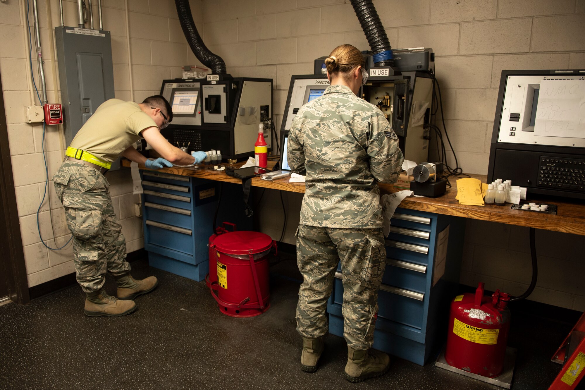 A photo of Airmen testing oil samples.