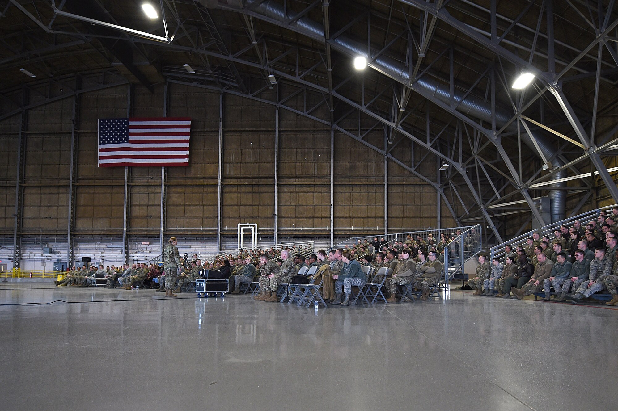 Col. Erin Staine-Pyne, 62nd Airlift Wing commander, speaks to members of the wing during a commander’s call Jan. 16, 2020 at Joint Base Lewis-McChord, Wash. Commander's calls are an opportunity for leadership to address thier Airmen face to face. (U.S. Air Force photo by Airman 1st Class Mikayla Heineck)