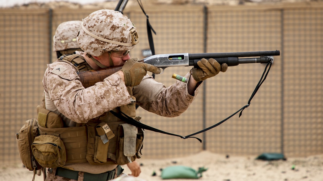 A U.S. Marine with 2nd Battalion, 7th Marines, assigned to Special Purpose Marine Air-Ground Task Force – Crisis Response – Central Command (SPMAGTF-CR-CC) 19.2, fires a Mossberg 590A1 12-gauge shotgun during a non-lethal weapons training exercise, Jan. 18, 2020. The SPMAGTF-CR-CC is a multiple force provider designed to employ ground, logistics and air capabilities throughout the Central Command area of responsibility. (U.S. Marine Corps photo by Sgt. Robert G. Gavaldon)