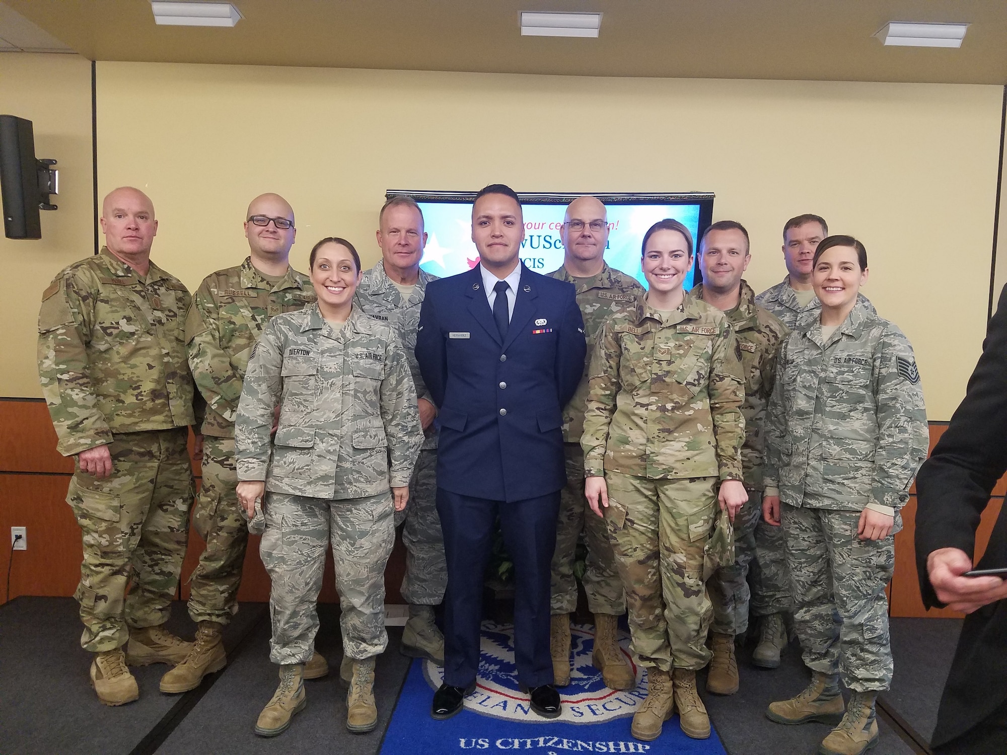 Airman David Hernandez (blue uniform), stands with members of the 132d Wing who came to watch him take the oath of allegiance as an American citizen December 20, 2019, in Des Moines, Iowa. (Courtesy Photo)