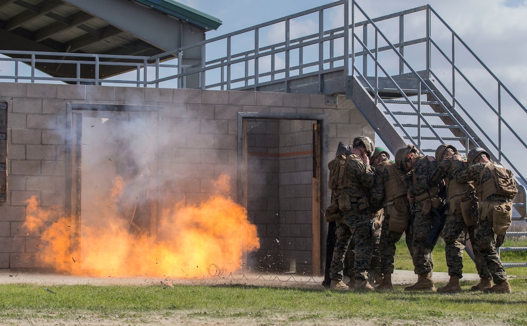 U.S. Marines brace themselves during urban mobility breaching training as part of the Infantry Assault Course on Marine Corps Base Camp Pendleton, Calif., Jan. 16.