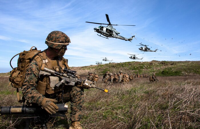 U.S. Marines provide security for UH-1Y Venoms at a landing zone during Exercise Venom Storm on San Clemente Island, Calif., Jan. 15.