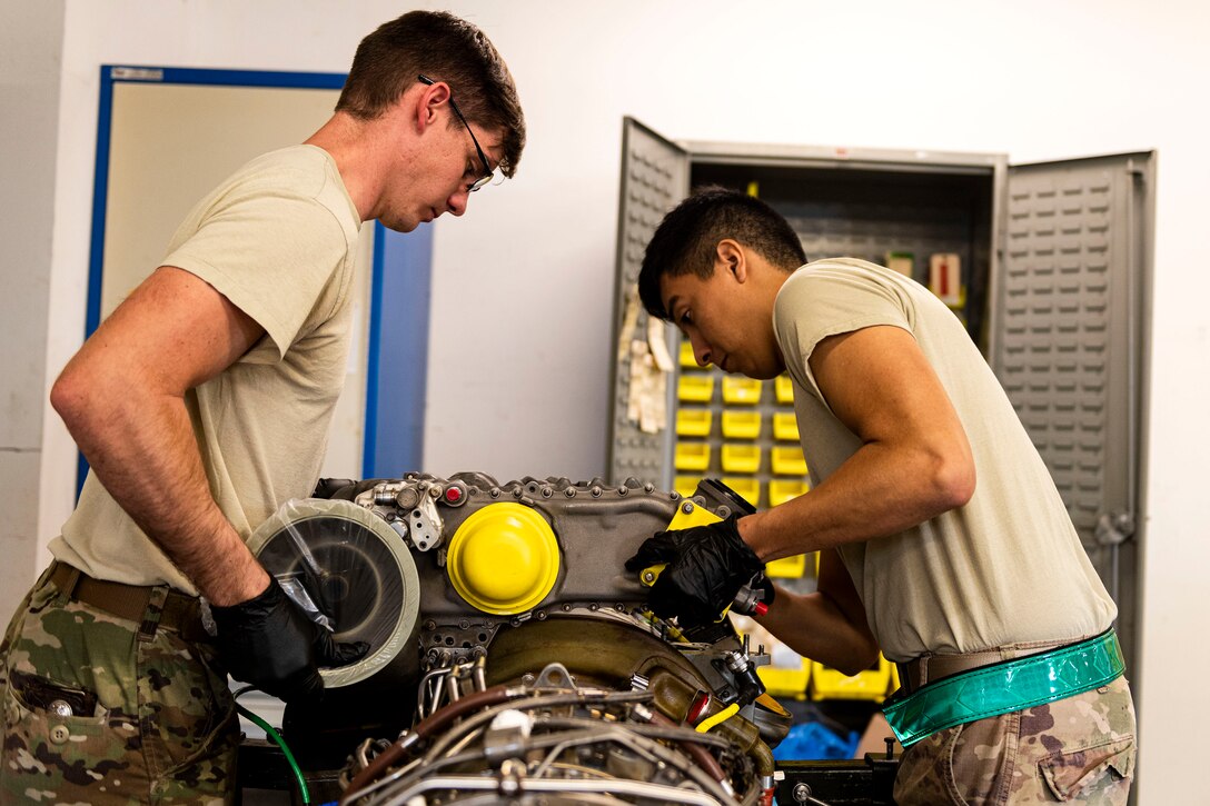 rman 1st Class Jonathan Flores, right, 41st Helicopter Maintenance Unit apprentice, and Staff Sgt. Leon Blomeley, 41st HMU craftsman, remove a gearbox during a gearbox seal replacement on a spare HH-60G Pave Hawk engine Jan. 15, 2020, at Moody Air Force Base, Georgia. These repairs are performed to increase spare-part availability of HH-60G engines. This allows the 41st HMU to swiftly return aircraft to mission-capable status without delay. (U.S. Air Force photo by Senior Airman Erick Requadt)