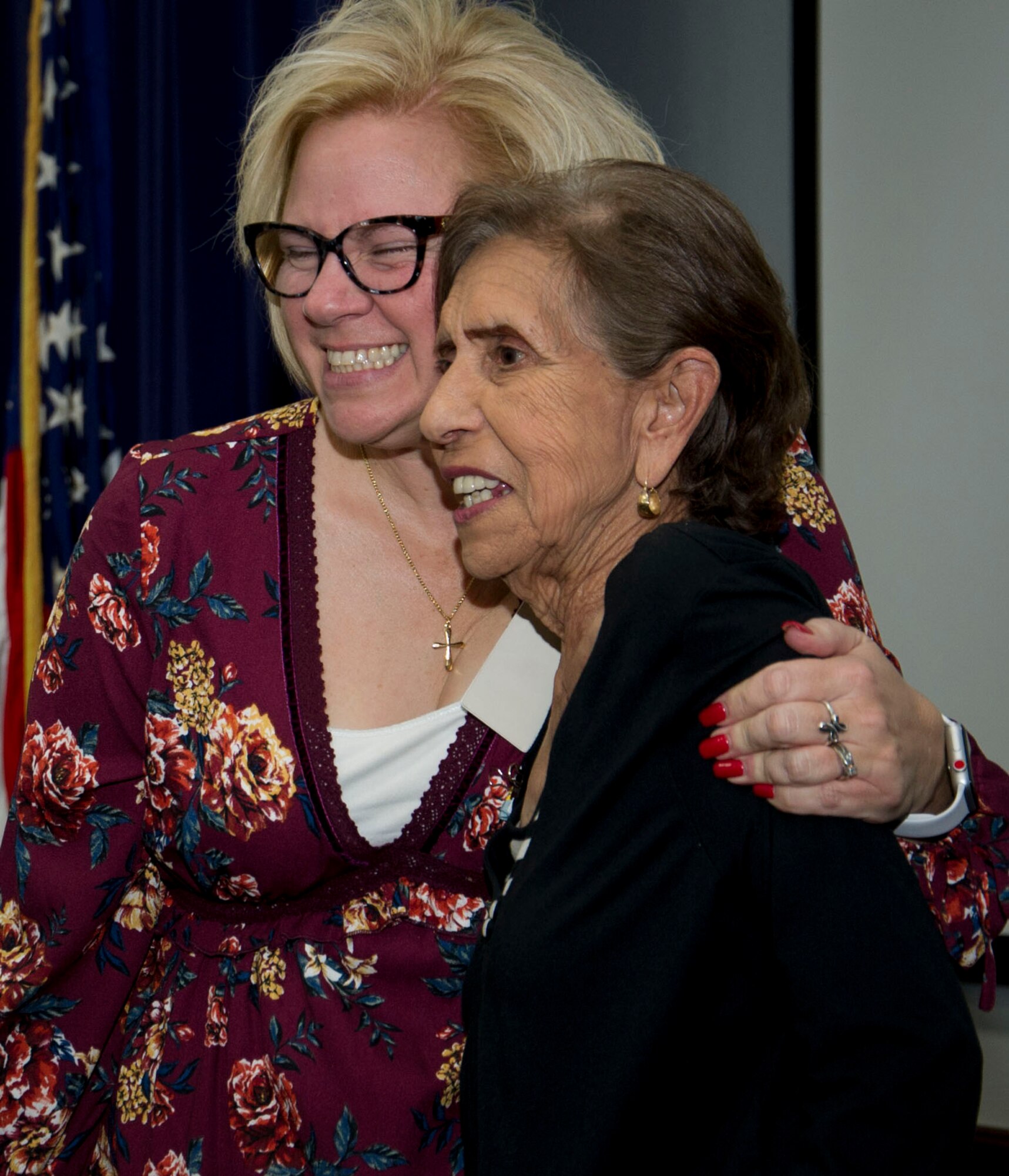 Tammy Hern embraces newly retired Mary Price with a hug following her retirement ceremony.