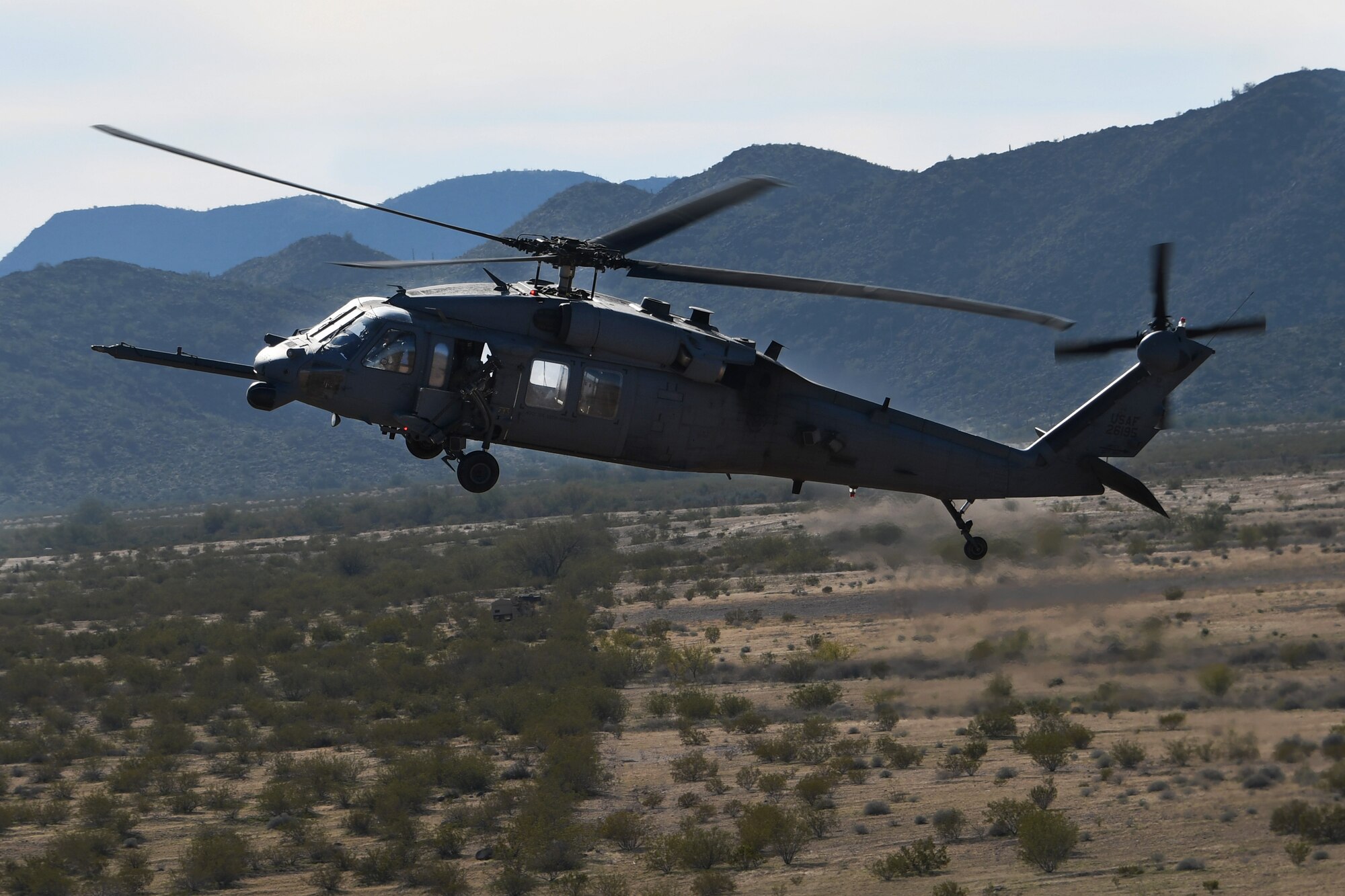 a photo of an HH-60 flying