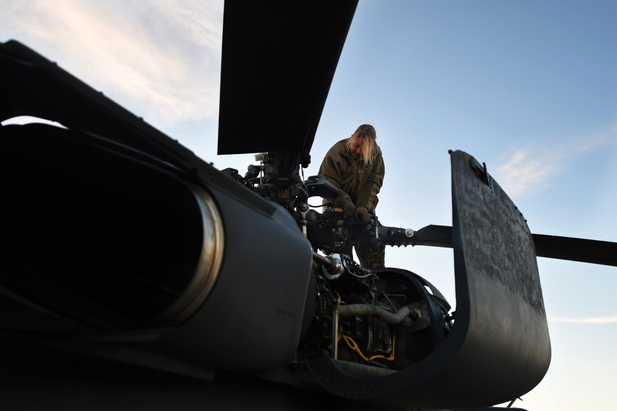 photo of an airman working on the HH-60