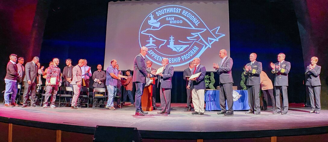The Navy welcomed 18 skilled, journey-level trade professionals into its workforce during the Southwest Regional Apprentice Program commencement ceremony Jan. 16, at Southwestern College’s Mayan Hall in Chula Vista, California.