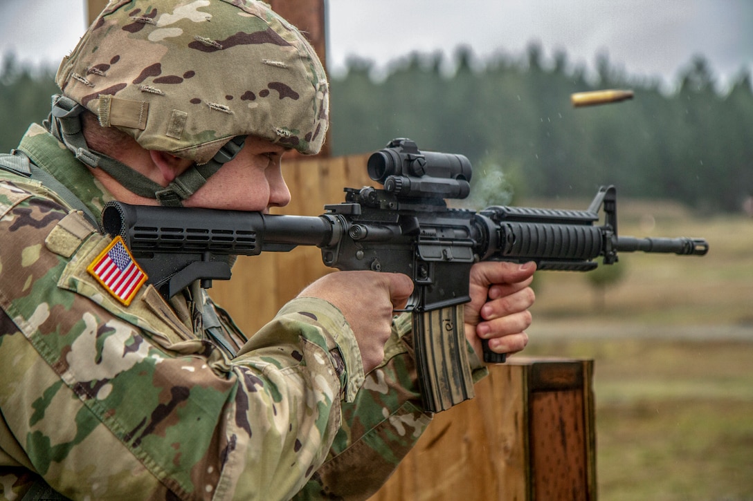 A soldier fires a weapon.