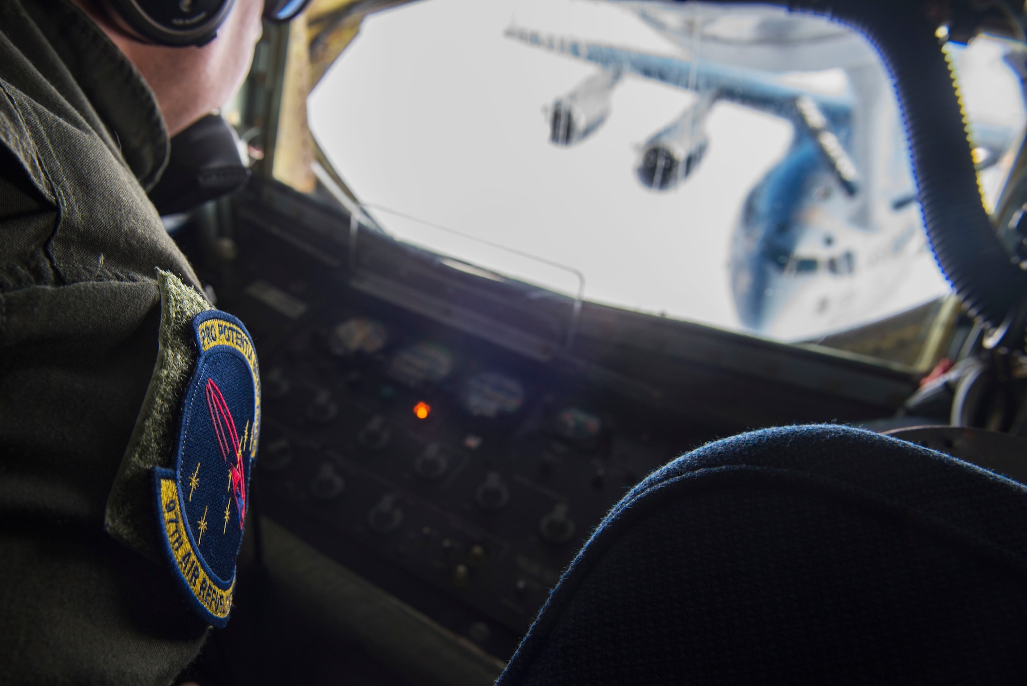 U.S. Air Force Master Sgt. Dillon Poole, 97th Air Refueling Squadron superintendent and boom operator, performs the 97th ARS’ first mission as a squadron with a C-17 Globemaster III from the 97th Airlift Squadron over the skies of Washington, Jan. 13, 2020. Refueling the C-17 served as training mission for aircrew Airmen from both aircraft, and included air refueling training connections, as well as simulated emergency separation procedures to ensure mission readiness. (U.S. Air Force photo by Senior Airman Lawrence Sena)