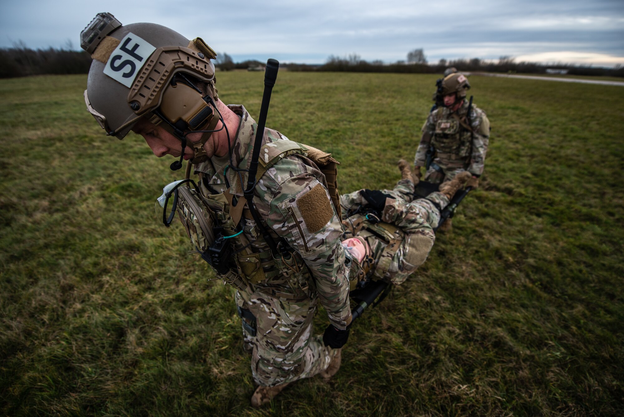 U.S. Air Force Staff Sgt. Taylor Sutton, 435th Security Forces Squadron ground combat readiness training center instructor, and his comrade carry a litter with a simulated casualty during exercise Frozen Defender in Grostenquin, France, Jan. 14, 2020. Frozen Defender tests the squadron’s capabilities in a contested environment under harsh conditions. The Defenders faced scenarios requiring self-aid and buddy care practices. (U.S. Air Force photo by Staff Sgt. Devin Boyer)