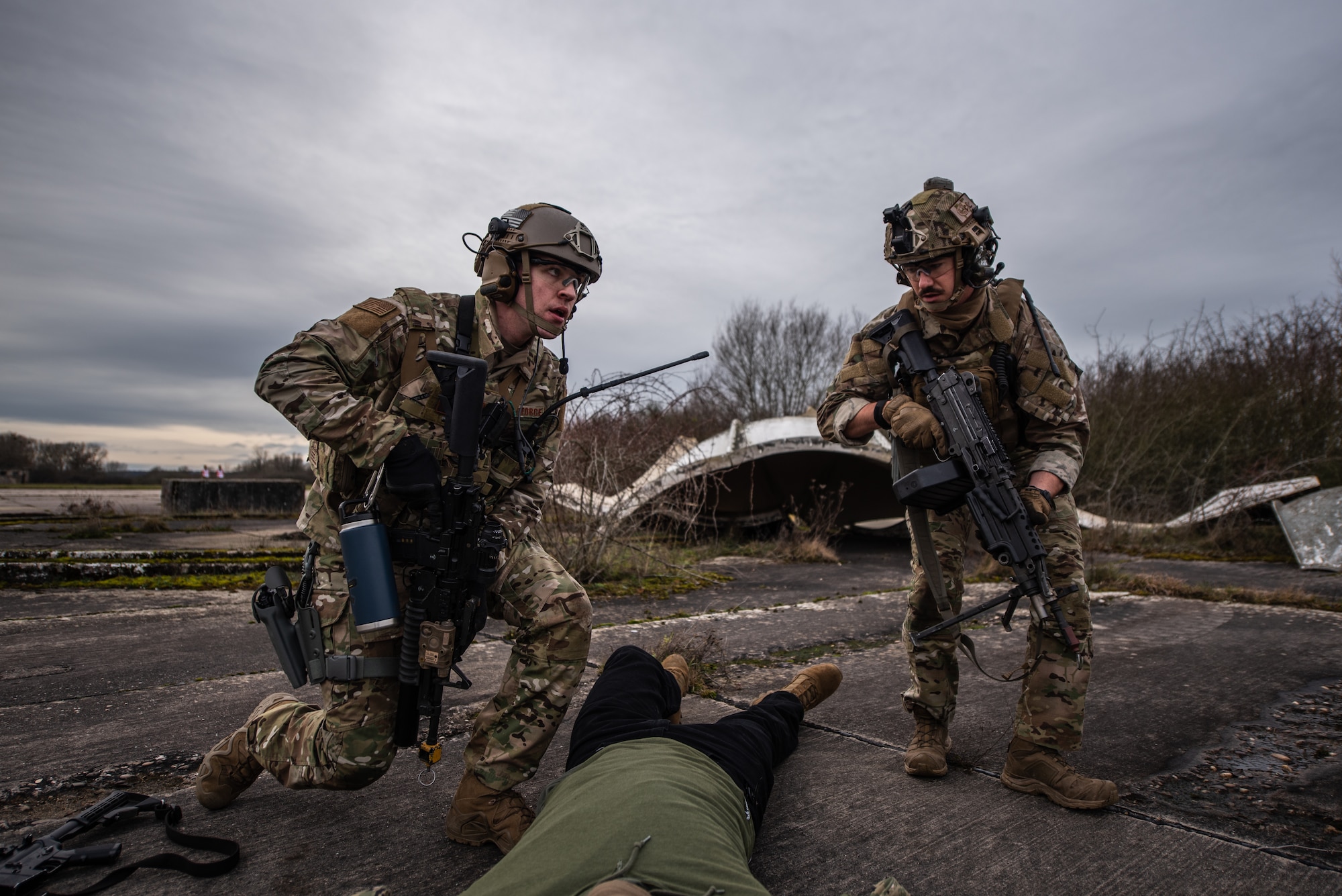 U.S. Air Force Staff Sgt. Dillion Rickman, 435th Security Forces Squadron vehicle maintainer, left, and Staff Sgt. Dwight Stalter, 435th SFS contingency response team leader, perform a body check during exercise Frozen Defender in Grostenquin, France, Jan. 14, 2020. Frozen Defender tests the squadron’s capabilities in a contested environment under harsh conditions. The 435th SFS is capable of securing areas in austere environments so their counterparts within the 435th Contingency Response Group can stand up airfields for air operations. (U.S. Air Force photo by Staff Sgt. Devin Boyer)