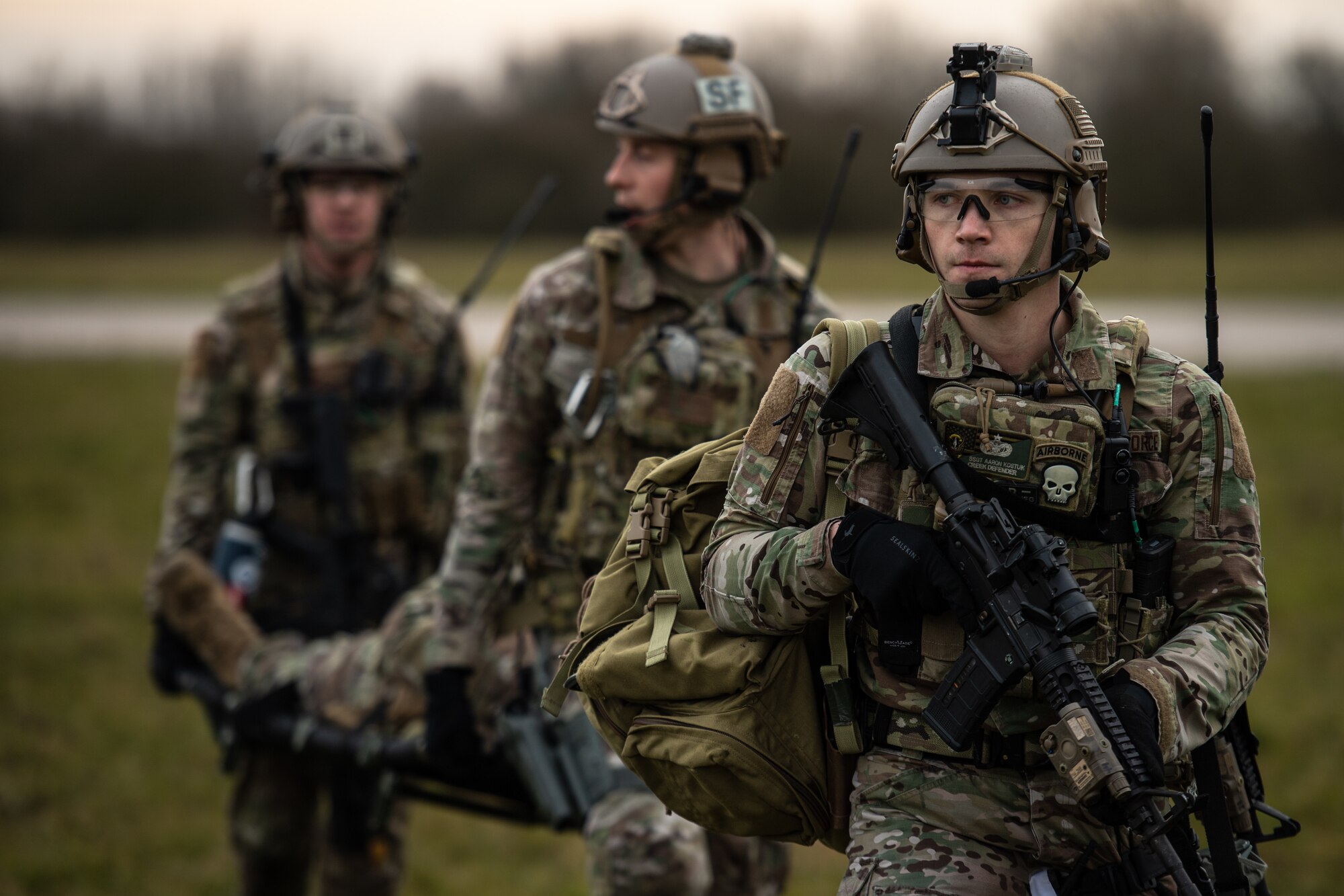 U.S. Air Force Staff Sgt. Aaron Kostiuk, 435th Security Forces Squadron ground combat readiness training center instructor, provides security for his comrades while they carry a simulated casualty during exercise Frozen Defender in Grostenquin, France, Jan. 14, 2020. Frozen Defender tests the squadron’s capabilities in a contested environment under harsh conditions. While the Defenders performed sweeps on the airfield, they were confronted by opposition forces and quickly responded to neutralize the threat. (U.S. Air Force photo by Staff Sgt. Devin Boyer)