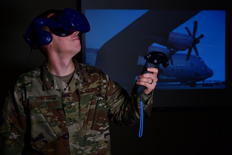 U.S. Air Force Staff Sgt. Kenneth Renfrow, 19th Maintenance Group maintenance qualifications training instructor, uses a virtual reality headset