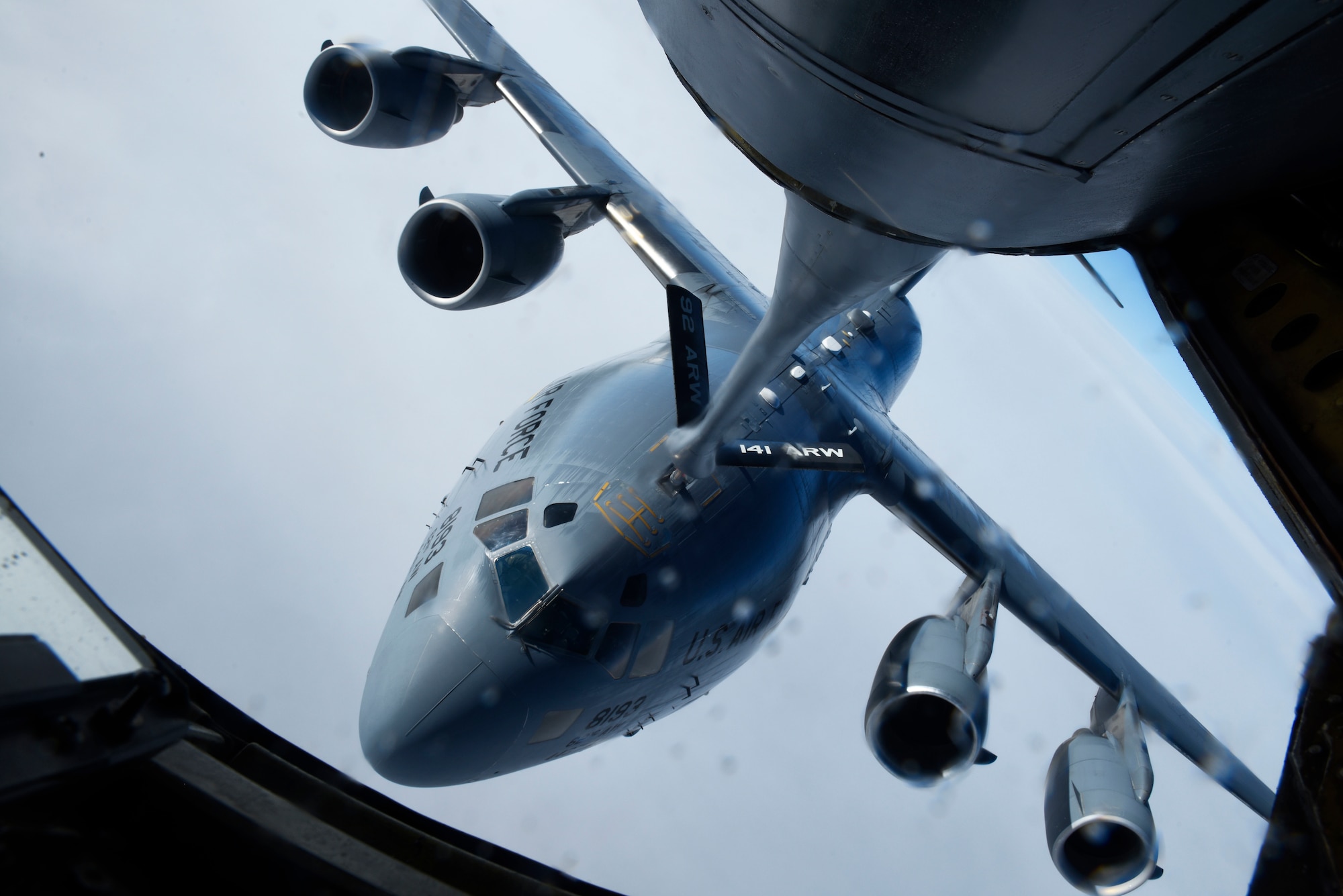 A KC-135 Stratotanker from the 92nd Air Refueling Wing performs an air refueling mission with a 97th Airlift Squadron C-17 Globemaster III during the 97th Air Refueling Squadron’s first mission over the skies of Washington, Jan. 13, 2020. Refueling the C-17 served as a training mission for aircrew Airmen from both aircraft, and included air refueling training contacts as well as simulated emergency separation procedures, ensuring mission readiness. (U.S. Air Force photo by Senior Airman Lawrence Sena)