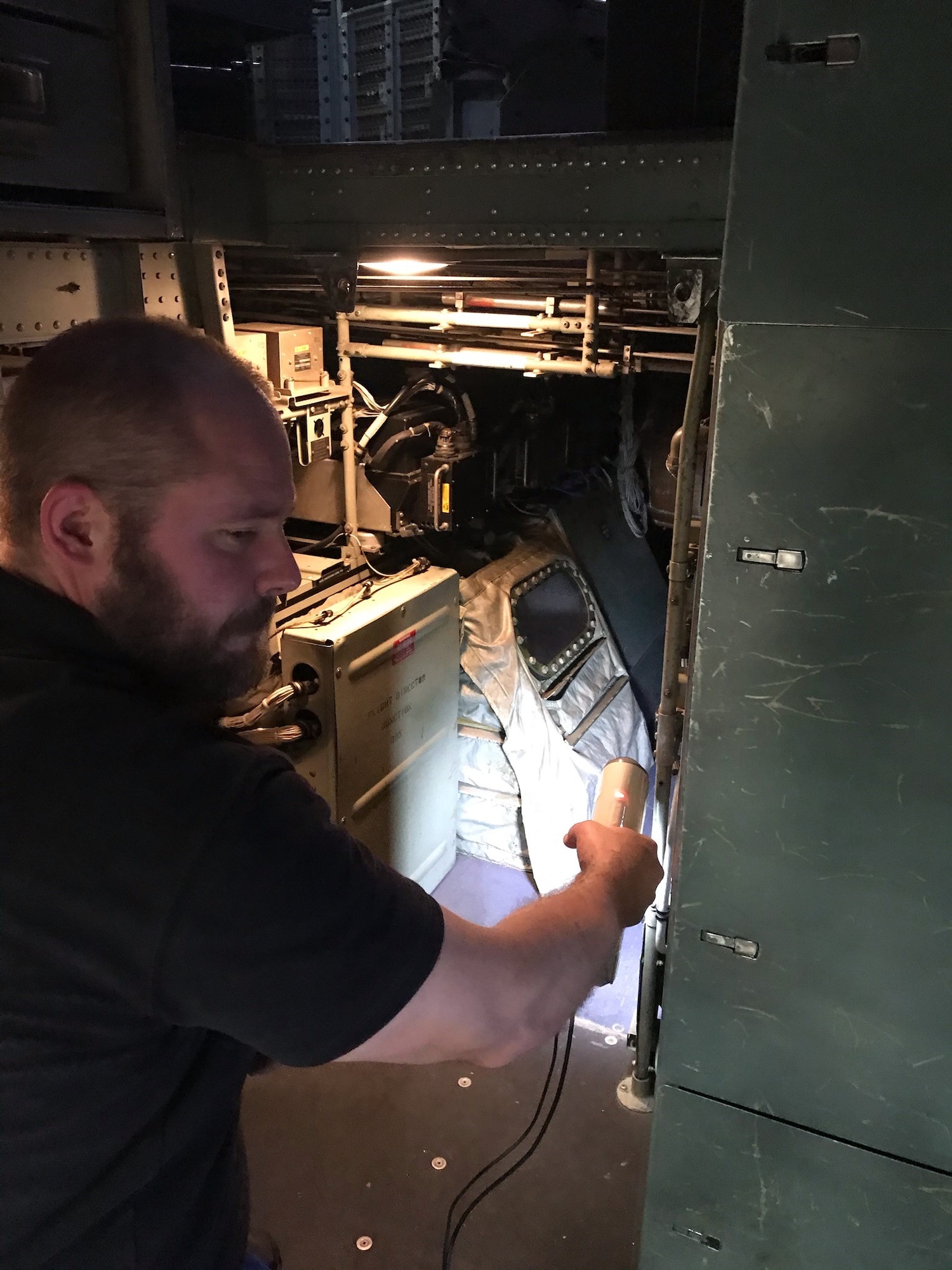 Jeffery Trei, a Mass Virtual team member, scans the avionics bay on a C-130J.