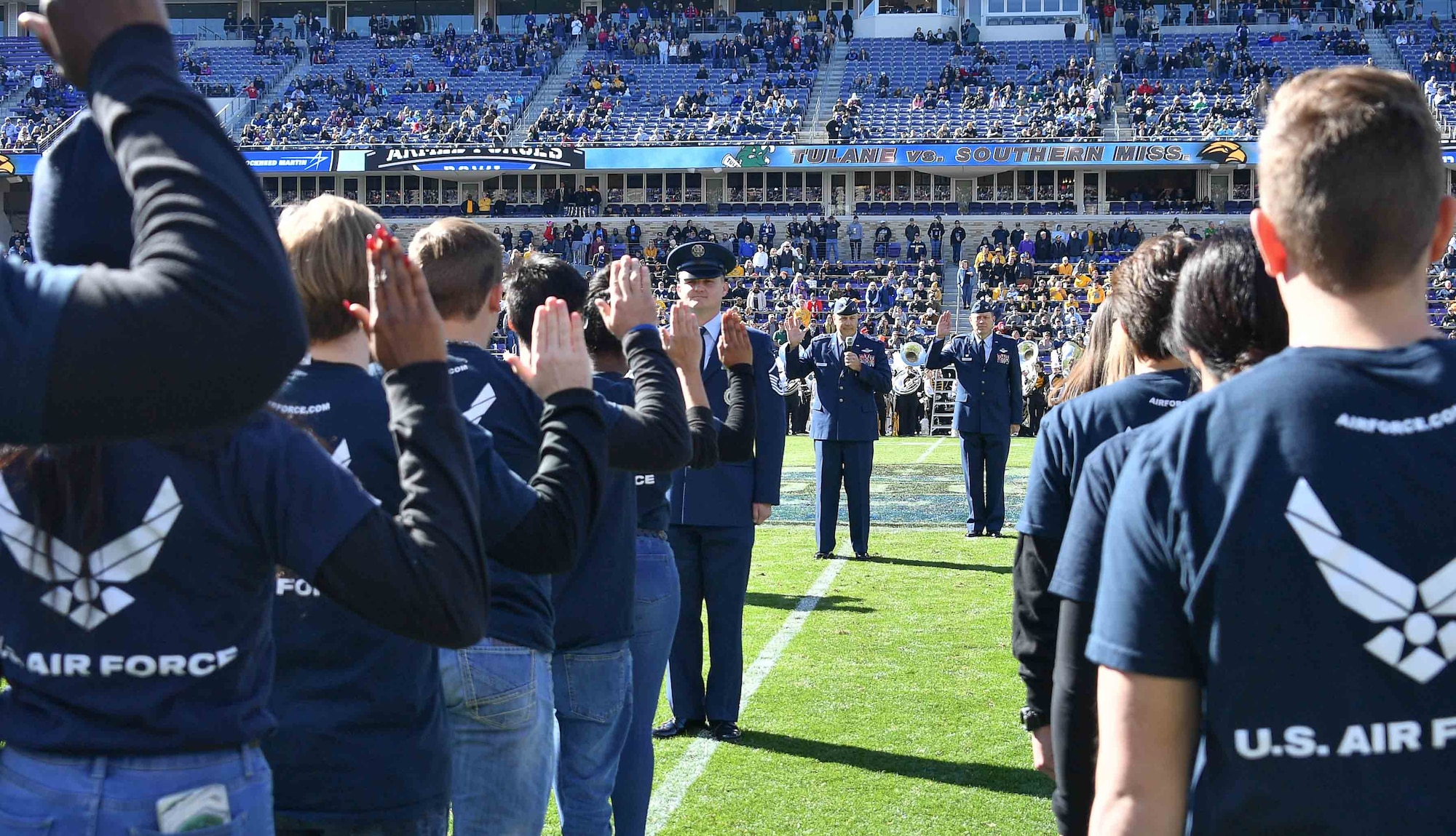 Tenth Air Force Commander Maj. Gen. Brian Borgen administers the oath of enlistment to 125 recruits during halftime at the Lockheed Martin Armed Forces Bowl on January 4, 2020 at Amon G. Carter Stadium in Fort Worth, Texas. The United States Army, Marines, Navy, Air Force and Coast Guard were represented by providing 25 recruits each who will join Active Duty, the National Guard and the Reserve. (U.S. Air Force photo by Jeremy Roman)