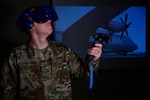 U.S. Air Force Staff Sgt. Kenneth Renfrow, 19th Maintenance Group maintenance qualifications training instructor, uses a virtual reality headset