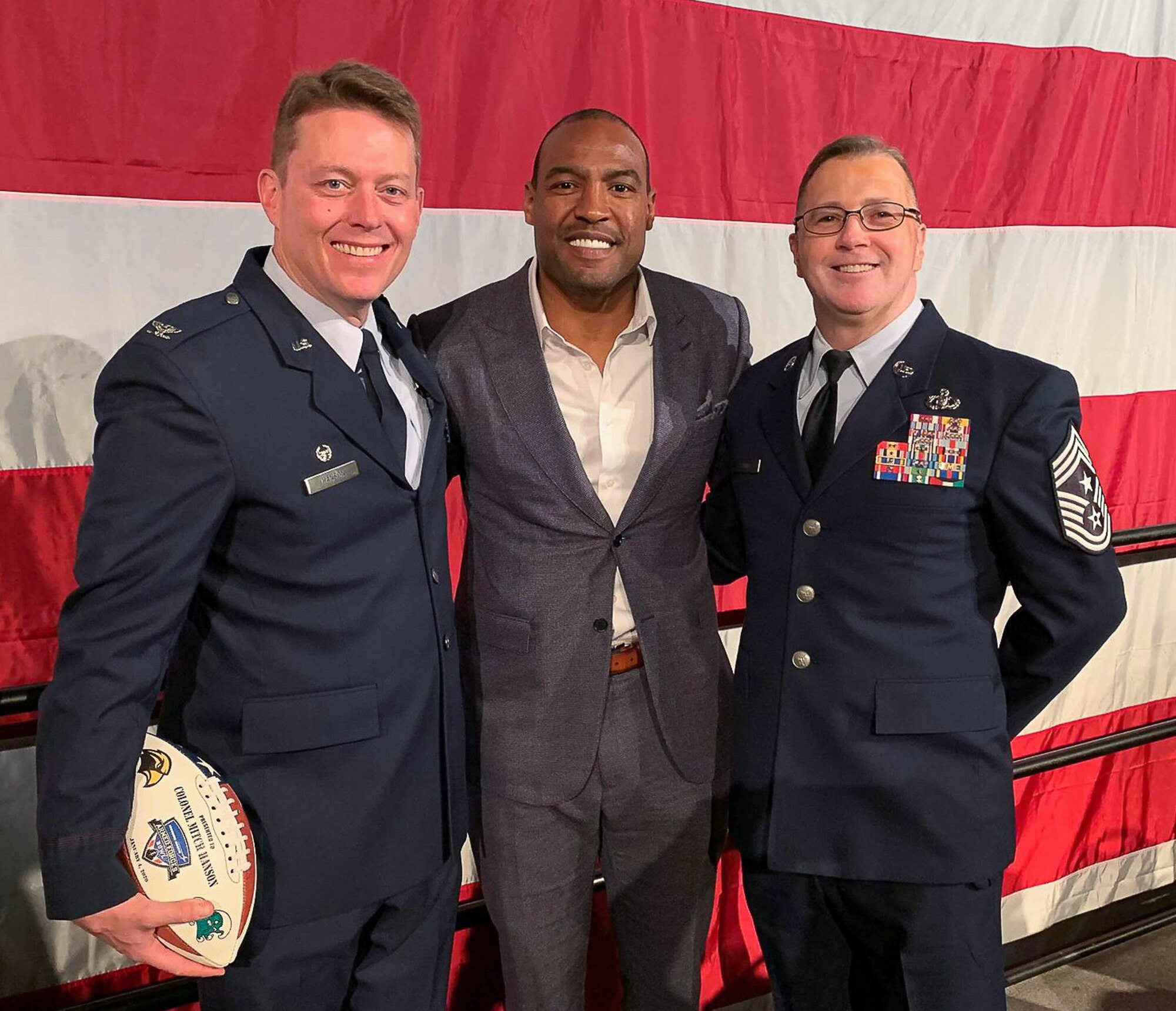 The 301st Fighter Wing’s Commander Col. Mitch Hanson and Command Chief Rob Safley speak with Lockheed Martin Armed Forces Bowl Kick-Off Luncheon Keynote Speaker Darren Woodson at the Fort Worth Convention Center on January 3, 2020 in Fort Worth, Texas. Woodson, a three-time Super Bowl champion and five-time Pro Bowl selection for the Dallas Cowboys, shared how the military has affected his life and why they have his utmost respect. (U.S. Air Force photo by Capt. Jessica Gross)