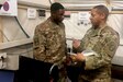 U.S. Army Maj. Hollis Gaynor, budget officer in the 30th Armored Brigade Combat Team, North Carolina National Guard, mentors Sgt. Devin Lewis, a noncommissioned officer in the headquarters company, 30th Armored Brigade Combat Team, while deployed in the Middle East, Jan. 16, 2020. The unit is encouraging Soldiers to seek out mentors and to understand the importance of serving others.