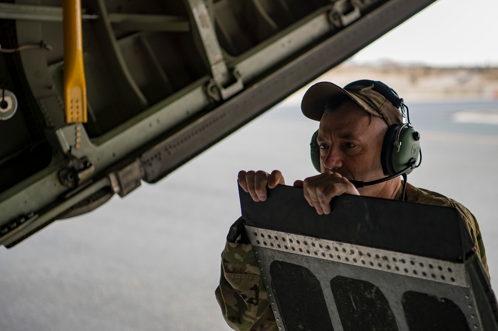 U.S. Air Force medical technician assigned to the 379th Expeditionary Aeromedical Evacuation Squadron waits for patients to arrive during an aeromedical evacuation mission at an undisclosed location, Jan. 3, 2020.