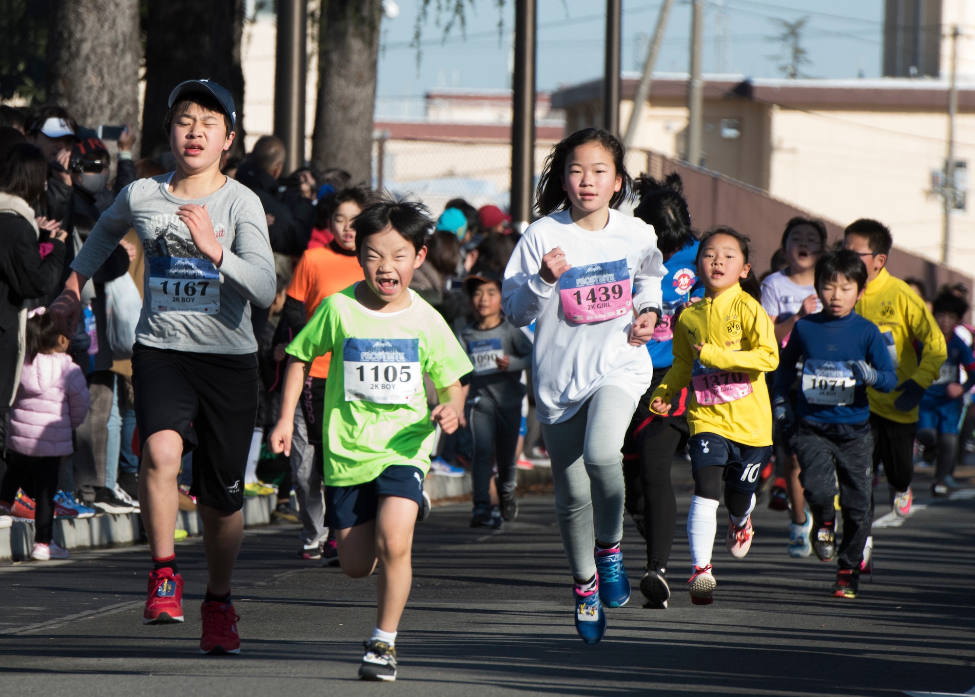 Children run the home stretch of the 2K Kids’ Run during the 39th Annual Frostbite Run, Jan.19, 2020, at Yokota Air Base, Japan.
