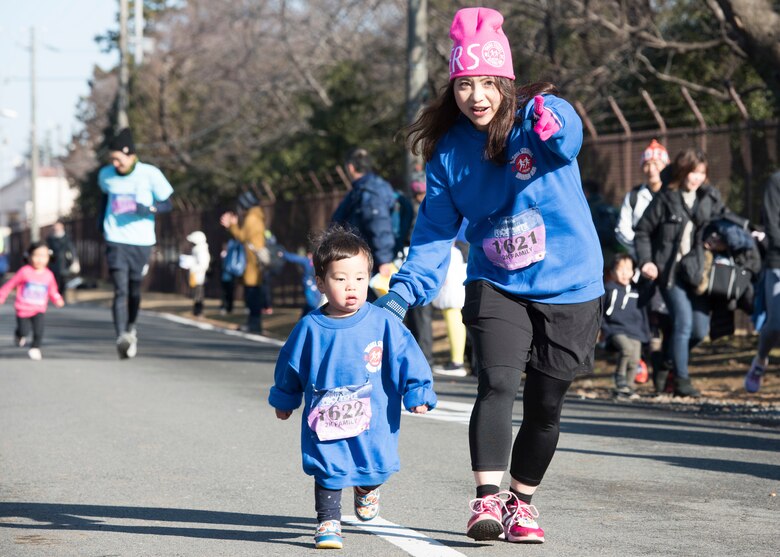 Participants run in a 2K Family Race during the 39th Annual Frostbite Run, Jan.19, 2020, at Yokota Air Base, Japan.