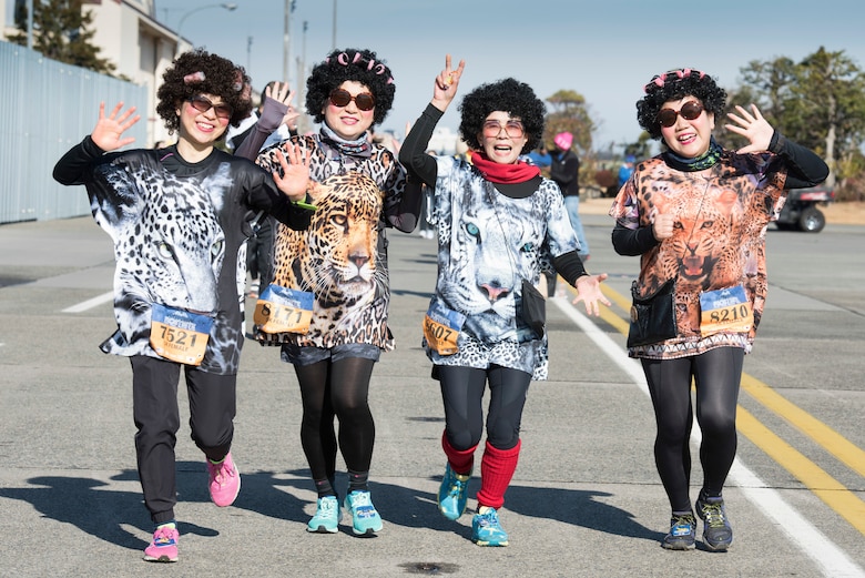 Runners in a 5K Race wave during the 39th Annual Frostbite Run, Jan.19, 2020, at Yokota Air Base, Japan.