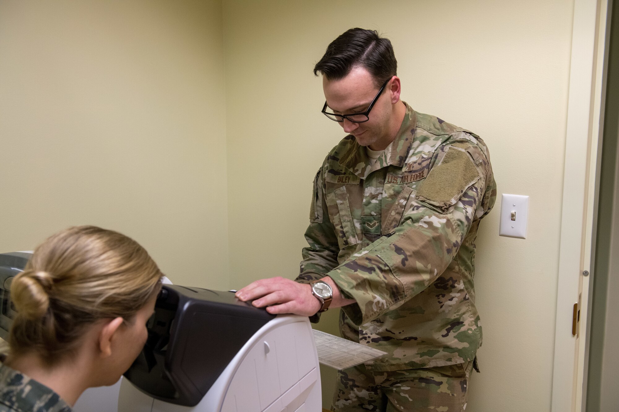 Vermont Air National Guardsman Senior Airman Corbin Bailey performs a vision examination